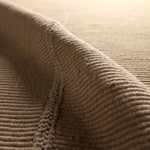 Featuring Bayana Rug by Jaipur Living at Amethyst Home. Authentic craftsmanship takes center stage with the Yatra Bayana. Handcrafted with meticulous care, this piece is sewn together in distinct channels, emulating the traditional techniques used by nomadic weavers with looms. Its solid tan shade and unique design elements create a contemporary aesthetic . Amethyst Home provides interior design, new home construction design consulting, vintage area rugs, and lighting in the Alpharetta metro area.