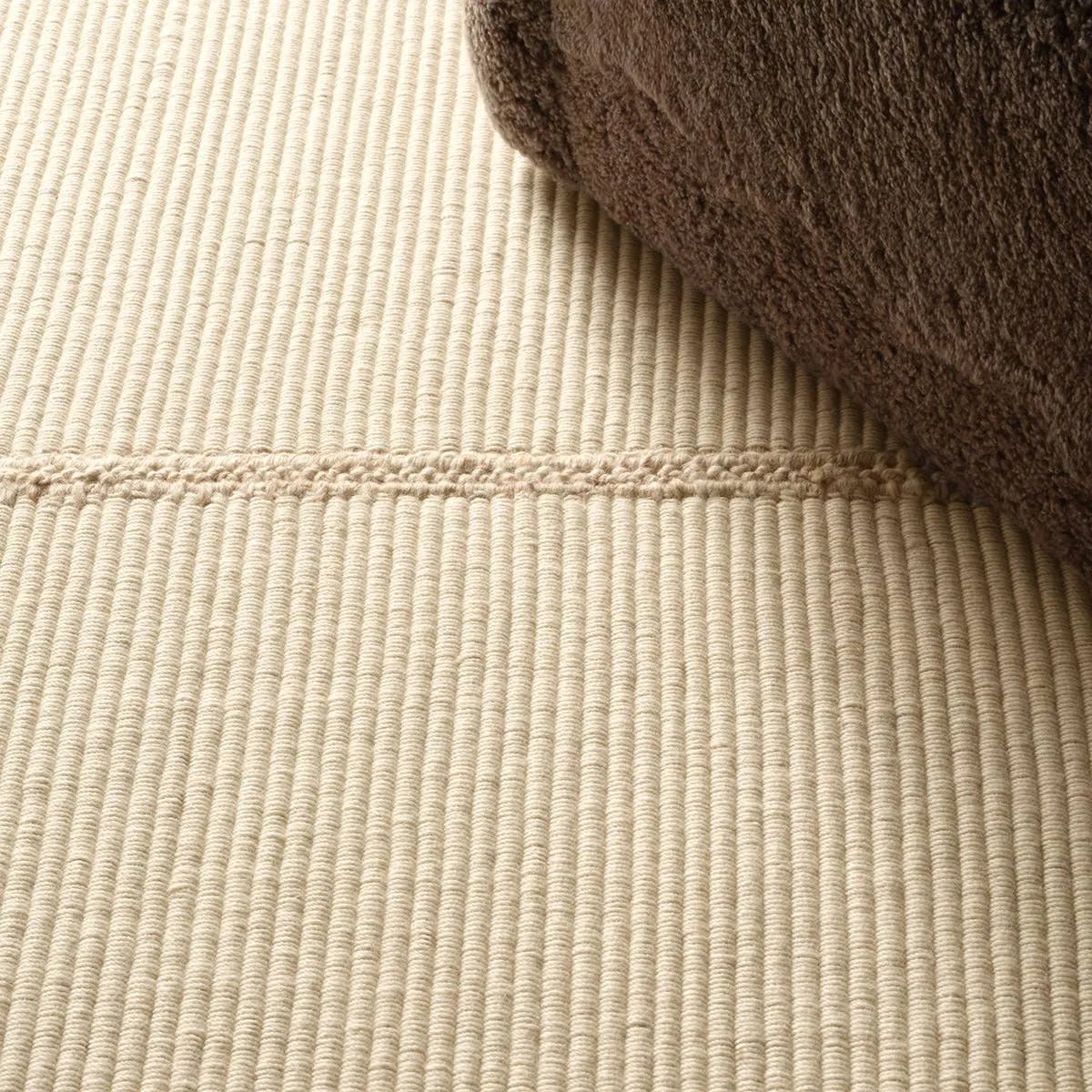 Featuring Bayana Rug by Jaipur Living at Amethyst Home. Authentic craftsmanship takes center stage with the Yatra Bayana. Handcrafted with meticulous care, this piece is sewn together in distinct channels, emulating the traditional techniques used by nomadic weavers with looms. Its solid white shade and unique design elements create a contemporary aestheti. Amethyst Home provides interior design, new home construction design consulting, vintage area rugs, and lighting in the Des Moines metro area.