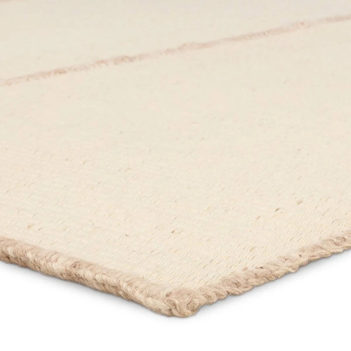 Featuring Bayana Rug by Jaipur Living at Amethyst Home. Authentic craftsmanship takes center stage with the Yatra Bayana. Handcrafted with meticulous care, this piece is sewn together in distinct channels, emulating the traditional techniques used by nomadic weavers with looms. Its solid white shade and unique design elements create a contemporary aesthetic. Amethyst Home provides interior design, new home construction design consulting, vintage area rugs, and lighting in the Park City metro area.