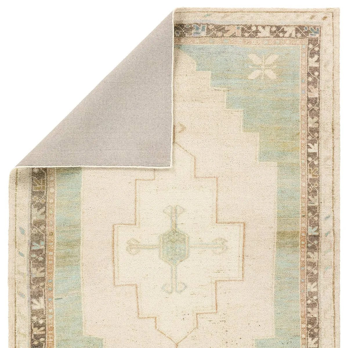Featuring Enigma Rug by Jaipur Living at Amethyst Home. The Enigma design blends timeless tradition with a vintage-inspired aesthetic. Featuring a striking central medallion, this rug boasts an elegant ivory and white backdrop, accented by light blue detailing. Its classic pattern and gently distressed finish give it an heirloom feel from the very first step.Ha. Amethyst Home provides interior design, new home construction design consulting, vintage area rugs, and lighting in the Omaha metro area.