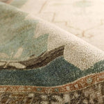 Featuring Enigma Rug by Jaipur Living at Amethyst Home. The Enigma design blends timeless tradition with a vintage-inspired aesthetic. Featuring a striking central medallion, this rug boasts an elegant ivory and white backdrop, accented by light blue detailing. Its classic pattern and gently distressed finish give it an heirloom feel from the very first. Amethyst Home provides interior design, new home construction design consulting, vintage area rugs, and lighting in the Winter Garden metro area.