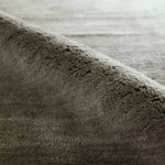 Featuring Judson Hand-Knotted Rug by Jaipur Living at Amethyst Home. The Bekarys Judson features shaggy texture with a remarkably soft pile that invites relaxation and warmth. Its solid neutral tones provide a versatile backdrop that enhances any decor. This plush, hand-knotted gem offers both tactile pleasure and visual appeal.Hand Knotted100% WoolBKR04 . Amethyst Home provides interior design, new home construction design consulting, vintage area rugs, and lighting in the Los Angeles metro area.