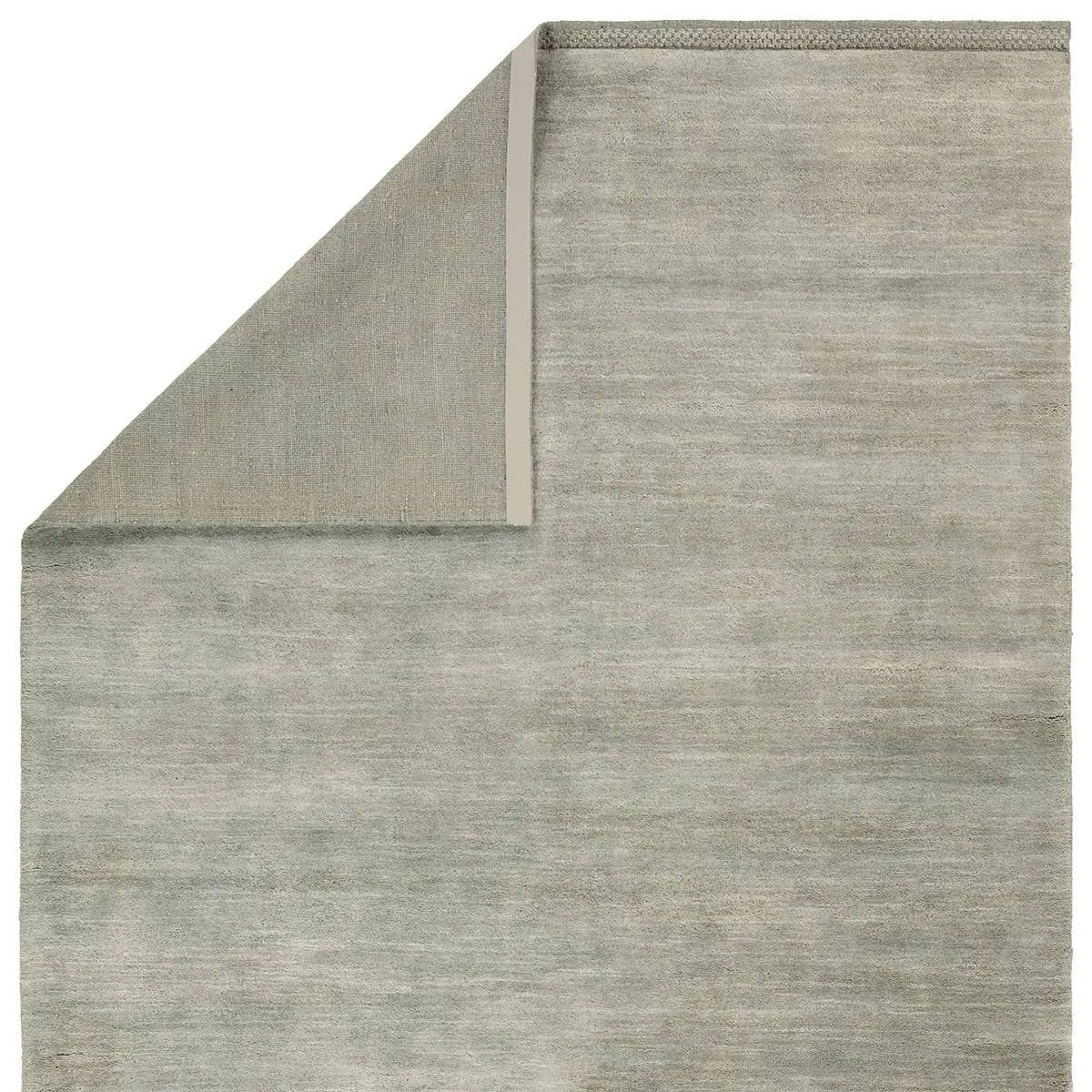 Featuring Judson Hand-Knotted Rug by Jaipur Living at Amethyst Home. The Bekarys Judson features shaggy texture with a remarkably soft pile that invites relaxation and warmth. Its solid neutral tones provide a versatile backdrop that enhances any decor. This plush, hand-knotted gem offers both tactile pleasure and visual appeal.Hand Knotted100% WoolBKR04 Be. Amethyst Home provides interior design, new home construction design consulting, vintage area rugs, and lighting in the San Diego metro area.