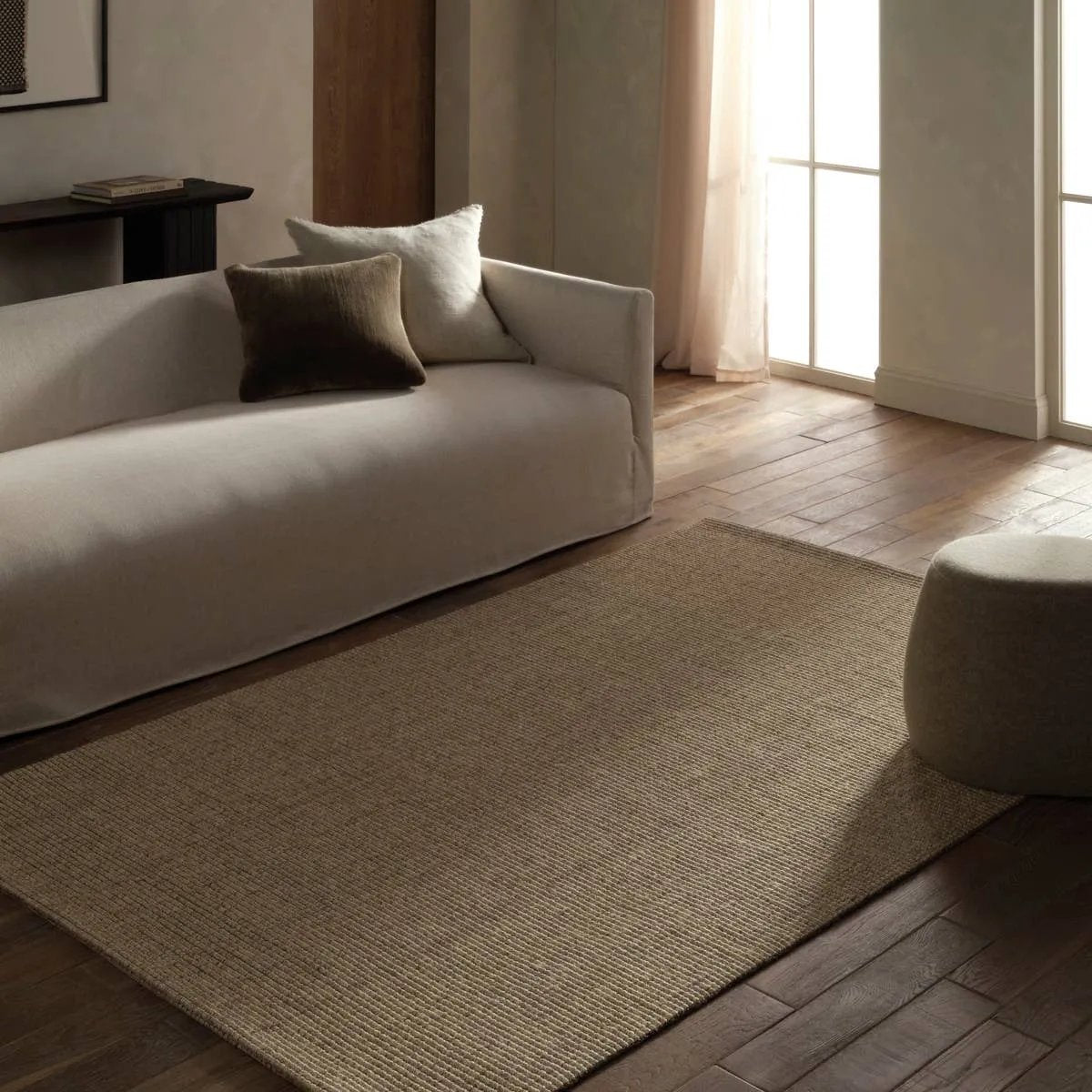 Featuring Bahan Laney Rug by Jaipur Living at Amethyst Home. The Bahan Laney grounds your space with airy shades and organic texture. Made from 100% natural sisal fibers, the Laney rug features a boucle weave for a subtle ribbed effect and a rubber latex back to secure it in place. With its organic sheen and easy-care qualities, it serves as a beautiful tac. Amethyst Home provides interior design, new home construction design consulting, vintage area rugs, and lighting in the San Diego metro area.