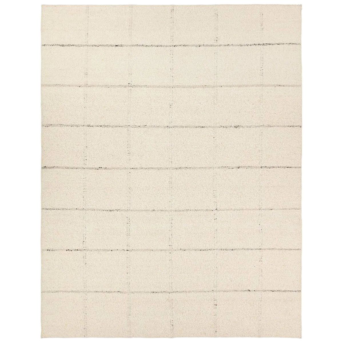 Featuring Leona Coart Rug by Jaipur Living at Amethyst Home. With its lofty, handmade loops, the Coart rug is an inviting, textural essential. Crafted of 100% undyed wool, its natural, relaxed, persona is met with a crisp, contemporary grid pattern.  An outstanding union of artistry and contemporary style, its physical approachability, monochromatic palette, an. Amethyst Home provides interior design, new home construction design consulting, vintage area rugs, and lighting in the Tampa metro area.