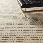 Featuring Leona  Elver Rug by Jaipur Living at Amethyst Home. The texture-rich Leona Elver offers an assortment of updated kilim looks, re-invented with the on-trend shearling style and neutral, modern palettes. The handwoven Elver rug features a globally inspired, gray dot and ticking line pattern on a neutral tan base. This 100% wool accent piece delights. Amethyst Home provides interior design, new home construction design consulting, vintage area rugs, and lighting in the Calabasas metro area.