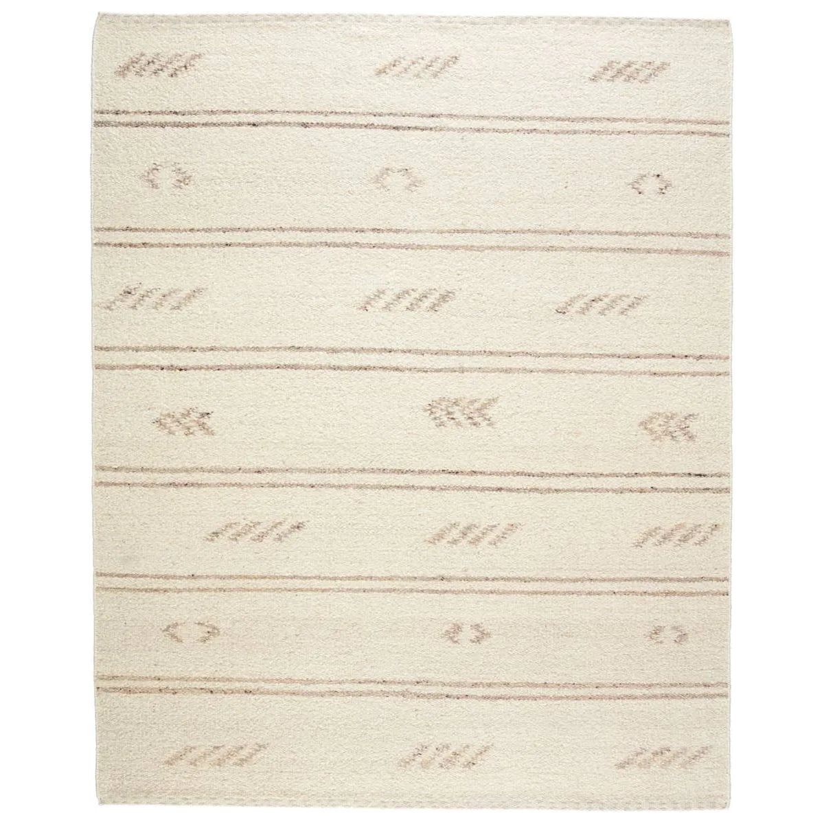 Featuring Leona  Essek Rug by Jaipur Living at Amethyst Home. The texture-rich Leona Essek offers an assortment of updated kilim looks, re-invented with the on-trend shearling style and neutral, modern palettes. The handwoven Essek rug features a globally inspired, light brown, stripe and tribal pattern on a neutral cream base. This 100% wool accent piece deli. Amethyst Home provides interior design, new home construction design consulting, vintage area rugs, and lighting in the Dallas metro area.