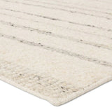 Featuring Leona Rya Rug by Jaipur Living at Amethyst Home. The texture-rich Leona Rya offers an assortment of updated kilim looks, re-invented with the on-trend shearling style and neutral, modern palettes. The handwoven Rya rug features a cream base with taupe stripes. This 100% wool accent piece delights in high and low traffic spaces such as bedrooms, livin. Amethyst Home provides interior design, new home construction design consulting, vintage area rugs, and lighting in the Dallas metro area.