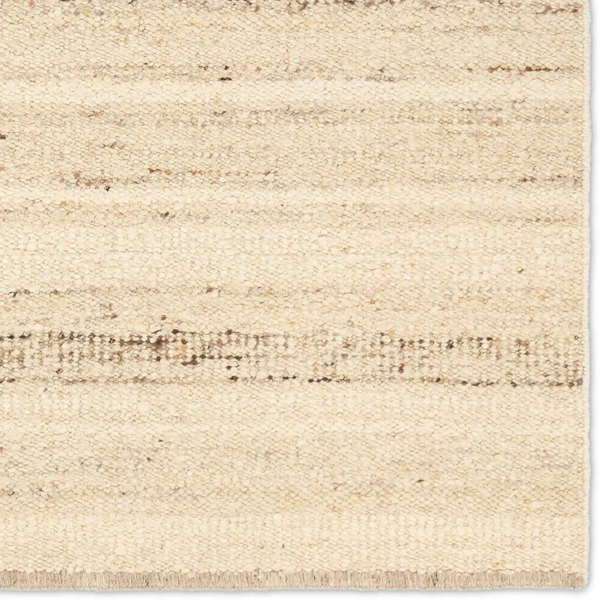 Featuring Leona Sollus Rug by Jaipur Living at Amethyst Home. The texture-rich Leona Sollus offers an assortment of updated kilim looks, re-invented with the on-trend shearling style and neutral, modern palettes. The handwoven Sollus rug features a tan base with brown and beige stripes. This 100% wool accent piece delights in high and low traffic spaces such. Amethyst Home provides interior design, new home construction design consulting, vintage area rugs, and lighting in the Monterey metro area.