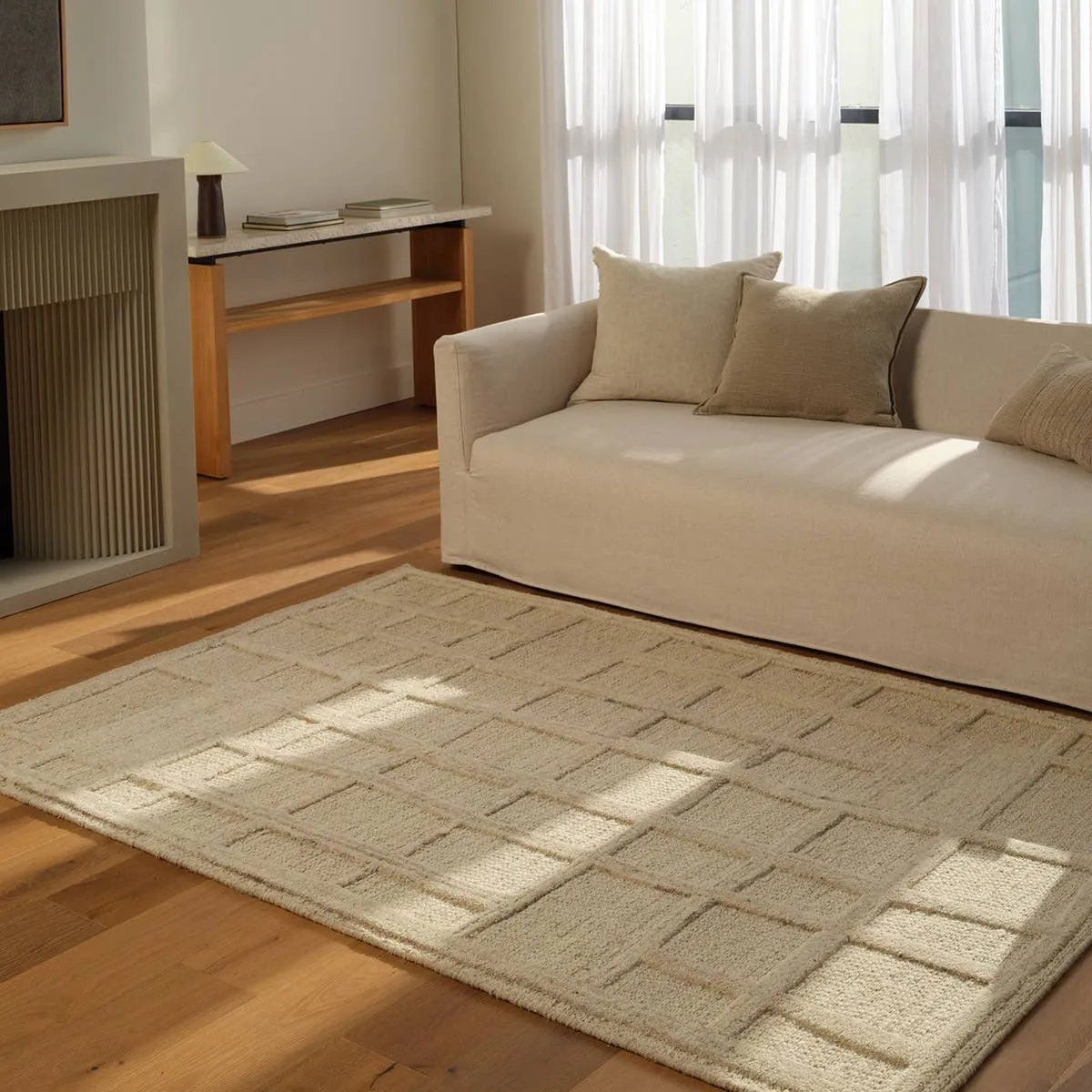 Featuring Lustrous Rug by Jaipur Living at Amethyst Home. The Lustrous design features flowing waves of 100% premium undyed wool in soft cream tones. Its high-low texture creates movement, adding an earthy, elemental ease to any modern space. Crafted with care to mimic a soumak weave, this rug offers timeless elegance and a soft, tactile feel.Hand Tufted100% . Amethyst Home provides interior design, new home construction design consulting, vintage area rugs, and lighting in the Seattle metro area.