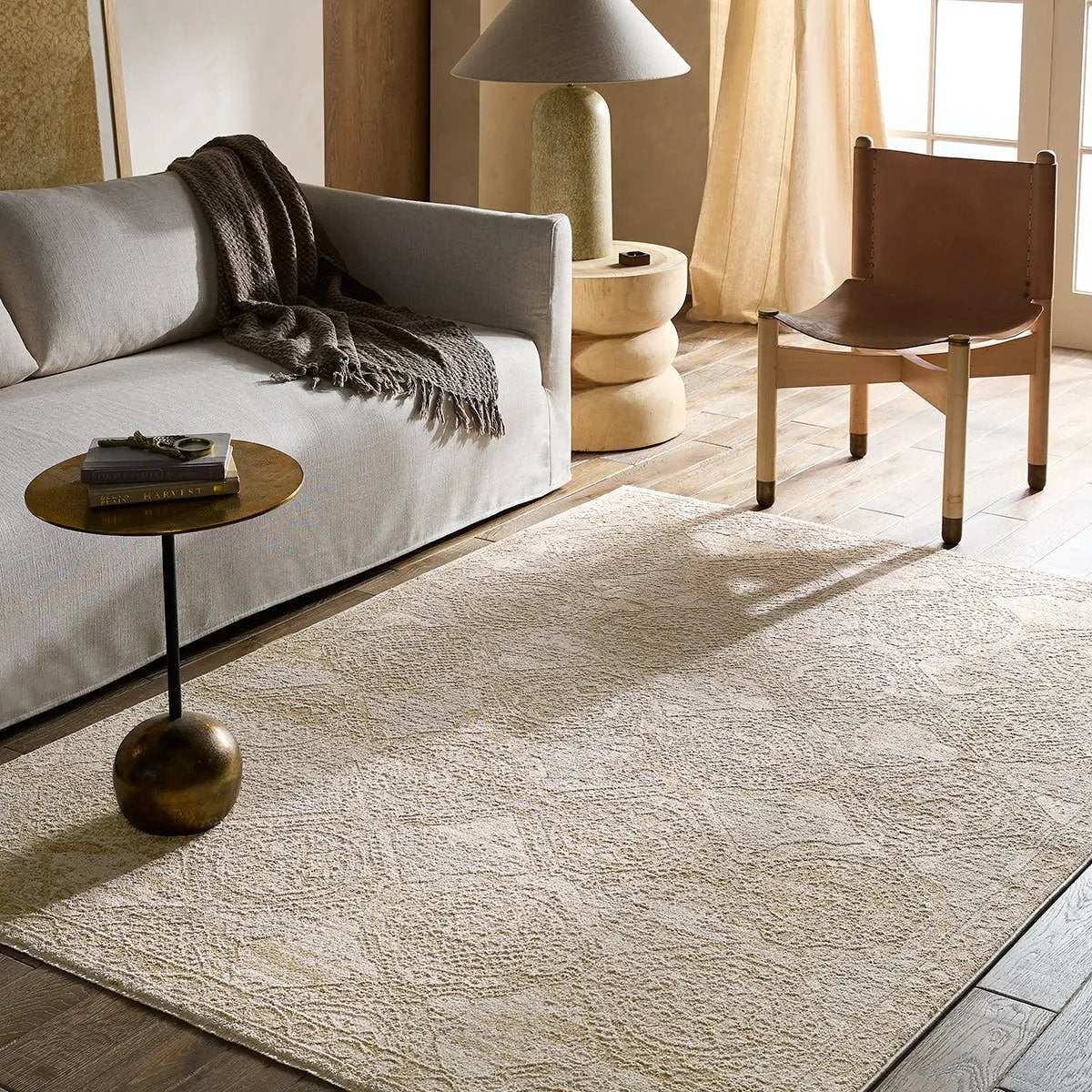 Featuring Nara Rug by Jaipur Living at Amethyst Home. Elegant and classic, the Nara design presents a largely sought-after Oushak-inspired pattern in a durable, powerloomed construction. The beautiful white and tan oriental pattern effortlessly elevates any medium-traffic indoor setting. Space-dyed polyester introduces subtle, intriguing color variation, wh. Amethyst Home provides interior design, new home construction design consulting, vintage area rugs, and lighting in the Park City metro area.