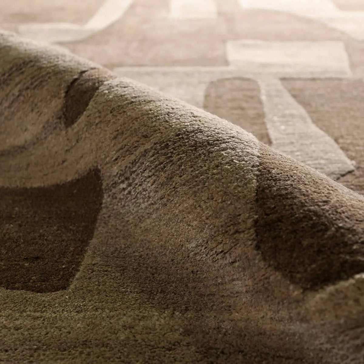 Featuring Anthem Noverre Rug by Jaipur Living at Amethyst Home. The hand-tufted Anthem Noverre infuses homes with contemporary aesthetics and modern Brutalist designs. Handmade of luxe viscose and wool blend, the Noverre design boasts a plush feel, worn-in look, high-low dimension, and subtle sheen. This piece grounds any indoor, medium-to-low traffic space. Amethyst Home provides interior design, new home construction design consulting, vintage area rugs, and lighting in the San Diego metro area.