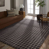 Featuring Oxford Club Rug by Jaipur Living at Amethyst Home. Elegant and casual in the same moment, the Oxford Club by Barclay Butera introduces handwoven accents to an array of spaces. This bolder and darker black colorway complements a range of palettes and styles, perfectly paired for modern and traditional homes alike. The Club design features a grid patte. Amethyst Home provides interior design, new home construction design consulting, vintage area rugs, and lighting in the Austin metro area.