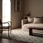 Featuring Quinlan Hand-Knotted Rug by Jaipur Living at Amethyst Home. The Quinlan design reinvents timeless geometric patterns, fusing classic charm with a modern edge. Soft beige tones, punctuated by a blue accent, elevate any mid-century modern space. Handcrafted from naturally stain-resistant wool, this rug handles medium-traffic areas, kids, and pets w. Amethyst Home provides interior design, new home construction design consulting, vintage area rugs, and lighting in the Alpharetta metro area.