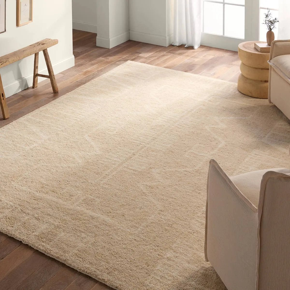 Featuring Repose  Essien Hand-Knotted Rug by Jaipur Living at Amethyst Home. The inviting and traditionally inspired Repose Essien marries stunning artisan quality and the beauty of natural, undyed wool. The Sherpa-like, hand-knotted construction of the Essien rug boasts a plush texture underfoot and is perfect for adding warmth and coziness to a space. The ne. Amethyst Home provides interior design, new home construction design consulting, vintage area rugs, and lighting in the Austin metro area.