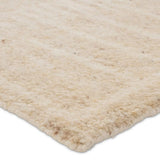 Featuring Repose  Essien Hand-Knotted Rug by Jaipur Living at Amethyst Home. The inviting and traditionally inspired Repose Essien marries stunning artisan quality and the beauty of natural, undyed wool. The Sherpa-like, hand-knotted construction of the Essien rug boasts a plush texture underfoot and is perfect for adding warmth and coziness to a space. T. Amethyst Home provides interior design, new home construction design consulting, vintage area rugs, and lighting in the Los Angeles metro area.