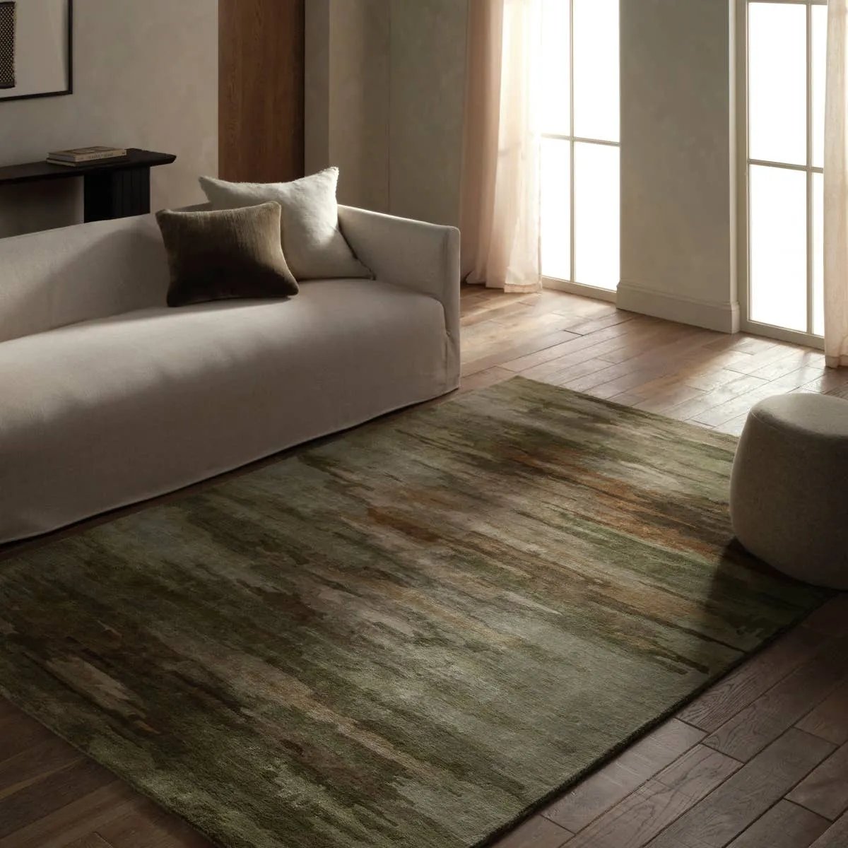 Featuring Ryenn Rug by Jaipur Living at Amethyst Home. Infused with a whimsical spirit and sophisticated flair, the Genesis Ryenn brings an artistic edge to any contemporary home. The Ryenn design features an abstract, grounding green and brown pattern, enhanced with a lustrous sheen reminiscent of shimmering water reflections.Hand Tufted60% Wool 40% Viscose. Amethyst Home provides interior design, new home construction design consulting, vintage area rugs, and lighting in the Monterey metro area.
