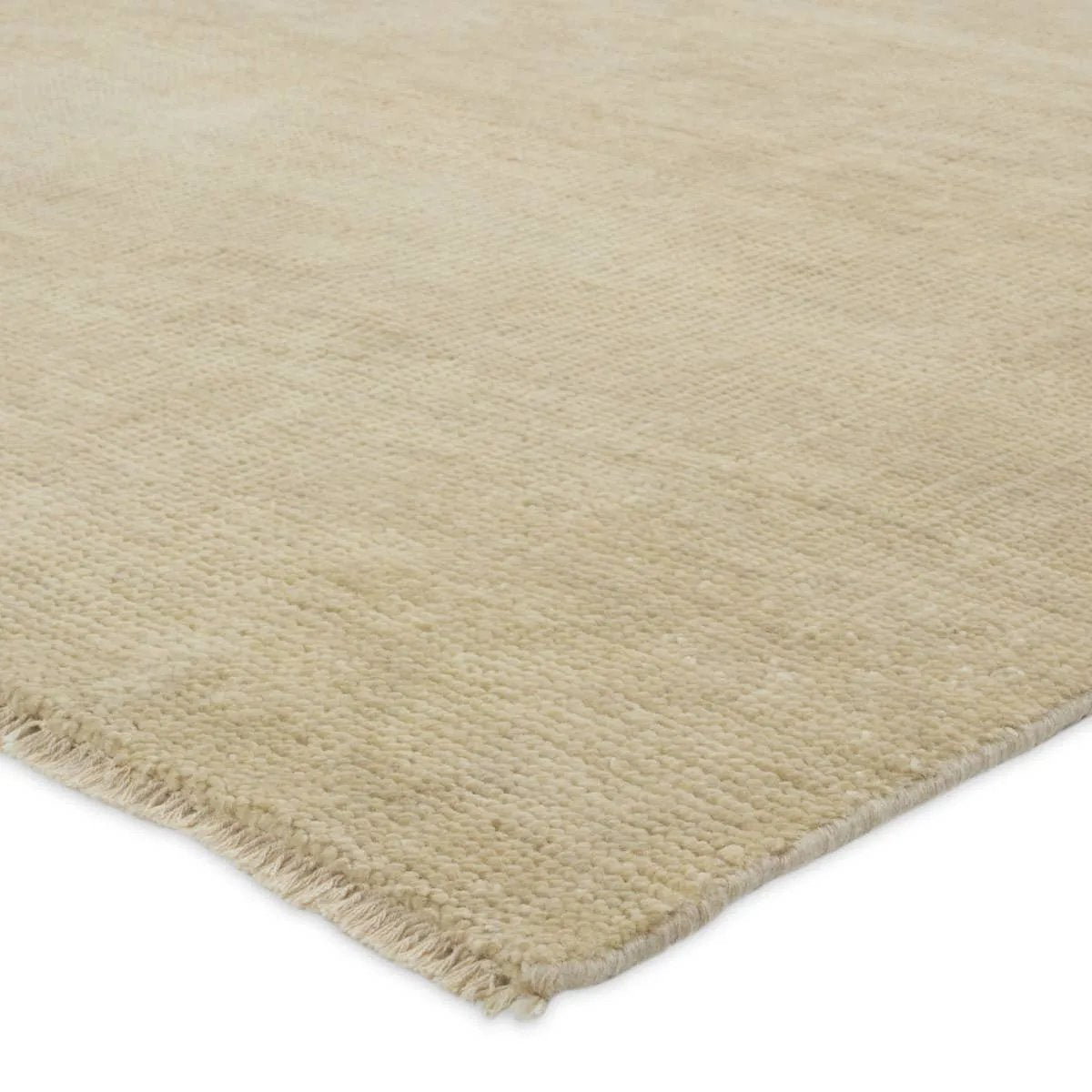 Featuring Saga Origin Hand-Knotted Rug by Jaipur Living at Amethyst Home. The sophisticated Saga Origin lends balance and a relaxed, grounding vibe to modern interiors. The Origin area rug anchors a space with a solid, subtly striated design in a neutral, ivory colorway. Hand knotted by skilled artisans, this durable wool accent marries simplicity and lux. Amethyst Home provides interior design, new home construction design consulting, vintage area rugs, and lighting in the Los Angeles metro area.