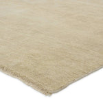 Featuring Saga Origin Hand-Knotted Rug by Jaipur Living at Amethyst Home. The sophisticated Saga Origin lends balance and a relaxed, grounding vibe to modern interiors. The Origin area rug anchors a space with a solid, subtly striated design in a neutral, ivory colorway. Hand knotted by skilled artisans, this durable wool accent marries simplicity and lux. Amethyst Home provides interior design, new home construction design consulting, vintage area rugs, and lighting in the Los Angeles metro area.