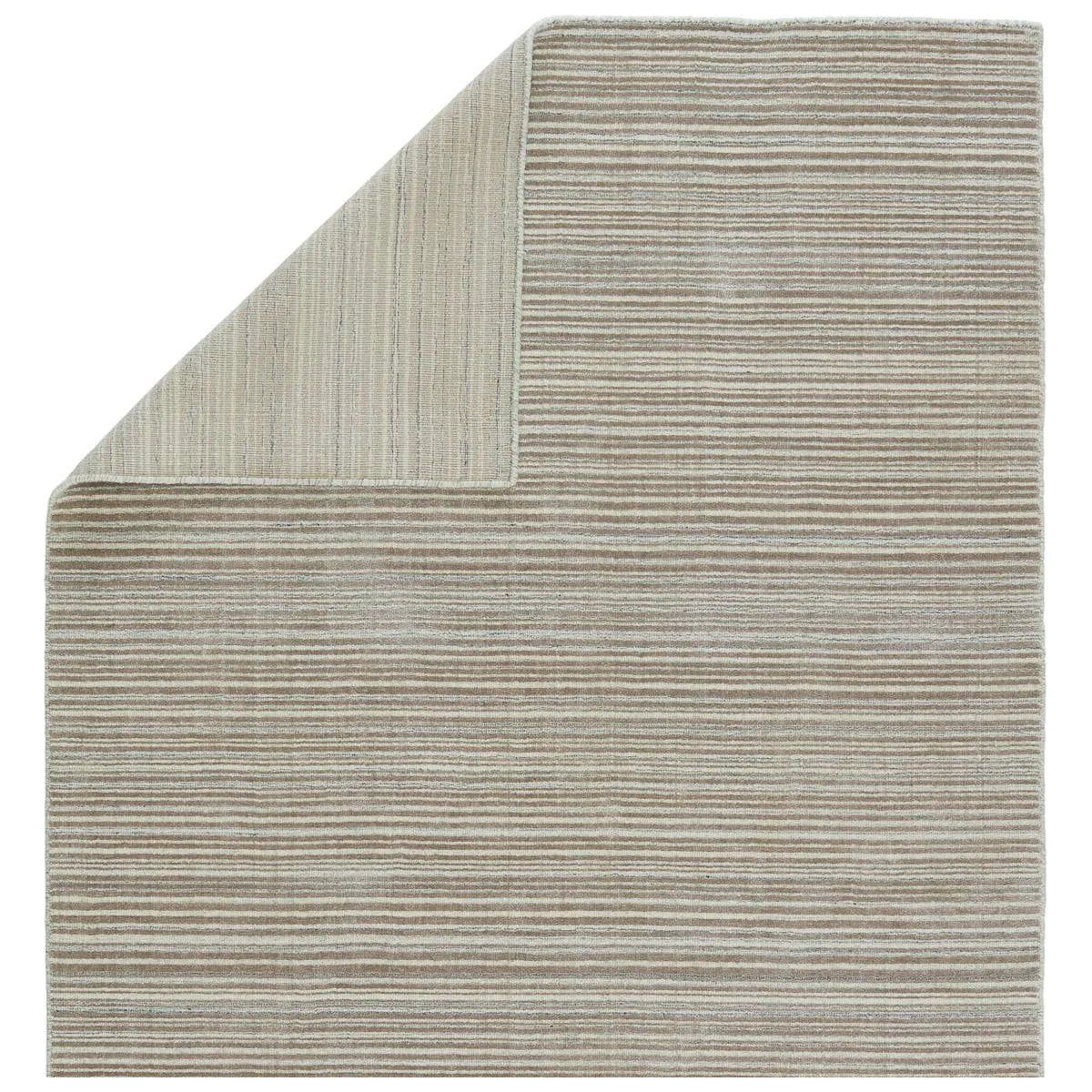 Featuring Second Sunset  Gradient Rug by Jaipur Living at Amethyst Home. The easy-to-decorate, earthy tones of the Second Sunset Gradient prove that simplicity can sometimes be striking. The Gradient rug is hand loomed of durable wool and jasmine for a sumptuous and inviting hand. The variation in the light taupe, ivory, and gray tones of this lustrous rug c. Amethyst Home provides interior design, new home construction design consulting, vintage area rugs, and lighting in the Monterey metro area.