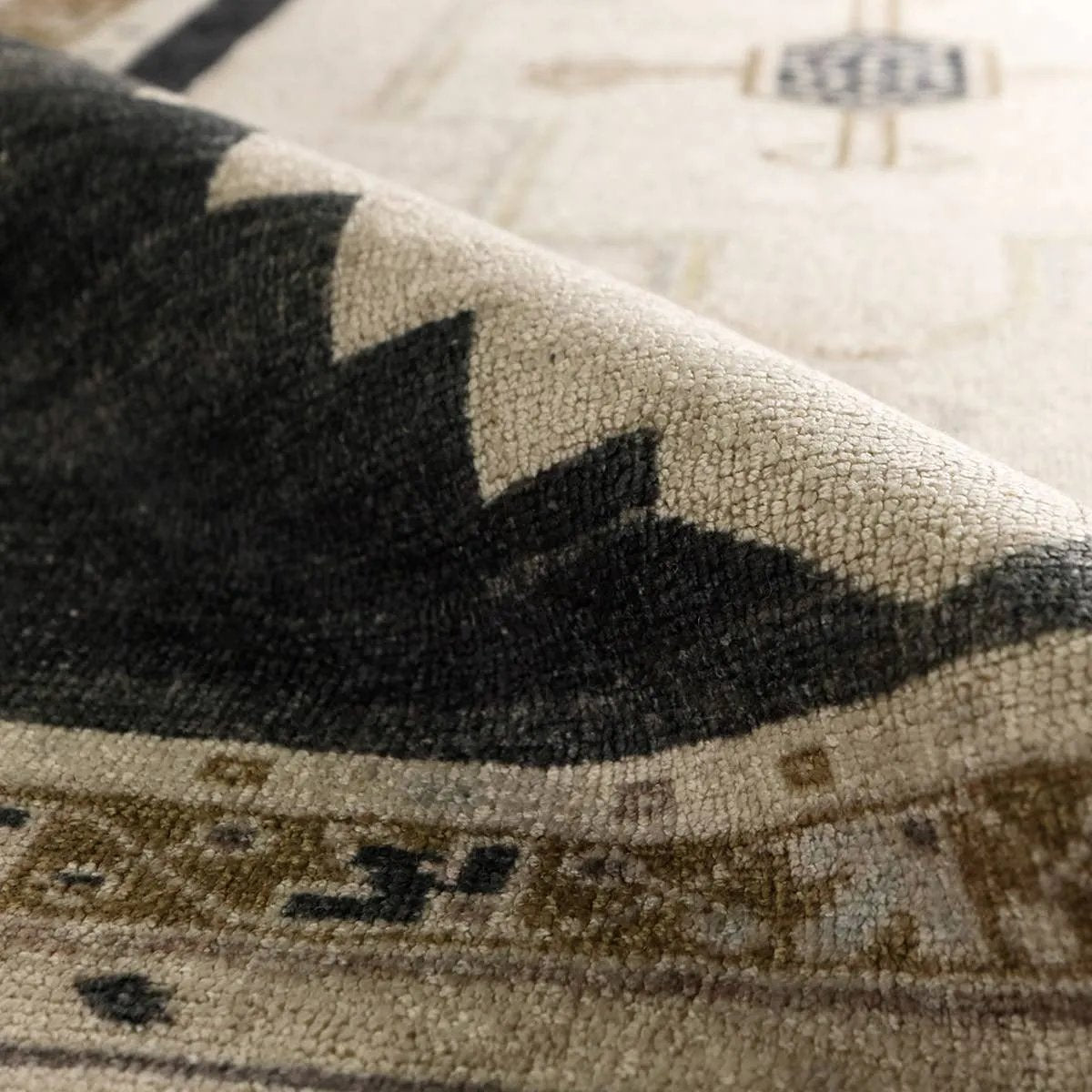 Featuring Stellar Rug by Jaipur Living at Amethyst Home. The Stellar design merges timeless tradition with a vintage-inspired aesthetic. Featuring a striking central medallion, this rug is set against an elegant beige and black backdrop, accented by rich green detailing. Its classic pattern, paired with a gently distressed finish, creates an heirloom qu. Amethyst Home provides interior design, new home construction design consulting, vintage area rugs, and lighting in the Winter Garden metro area.