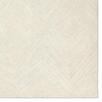 Featuring Tulsi Rug by Jaipur Living at Amethyst Home. The handtufted Labyrinth Collection features abstract designs crafted from plush wool with a cut-and-looped pile, creating a rich, tactile texture. The Tulsi design showcases a bold, geometric pattern with modern Brutalist influence in varying shades of gray and taupe, adding depth and sophistication with i. Amethyst Home provides interior design, new home construction design consulting, vintage area rugs, and lighting in the Tampa metro area.