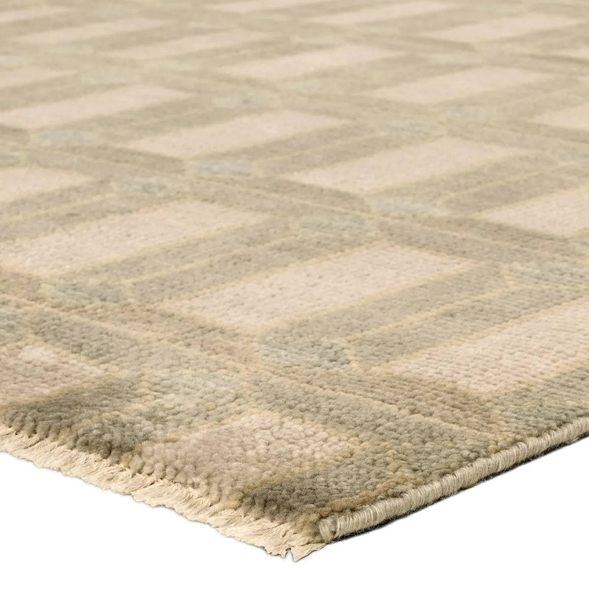 Featuring Vaila Hand-Knotted Rug by Jaipur Living at Amethyst Home. The Vaila design reinvents timeless geometric grid patterns, fusing classic charm with a modern edge. Soft beige tones elevate any mid-century modern space, while naturally stain-resistant wool handles medium-traffic areas, kids, and pets with ease. A durable yet stylish foundation, this p. Amethyst Home provides interior design, new home construction design consulting, vintage area rugs, and lighting in the Washington metro area.