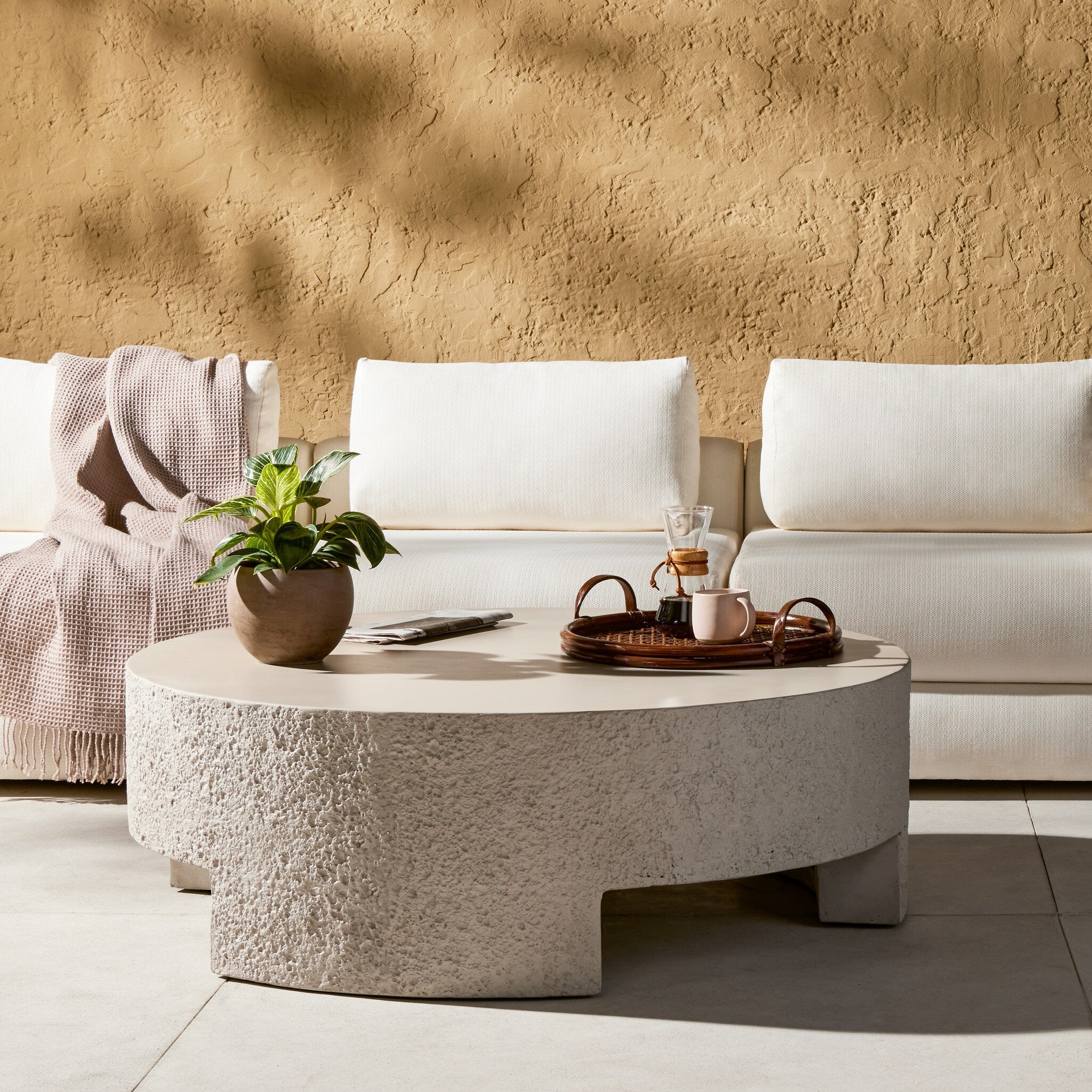 Featuring Everett Matte Stone Outdoor Coffee Table by Four Hands at Amethyst Home. A textured, white concrete coffee table perfect for modern and wabi sabi style.  The table has a matte texture and is perfect for indoors or outdoors.Overall Dimensions: 48.00"w x 48.00"d x 16.25"hWeight : 277.78 lbsMaterials : Concrete. Amethyst Home provides interior design, new construction, custom furniture, and area rugs in the Des Moines metro area