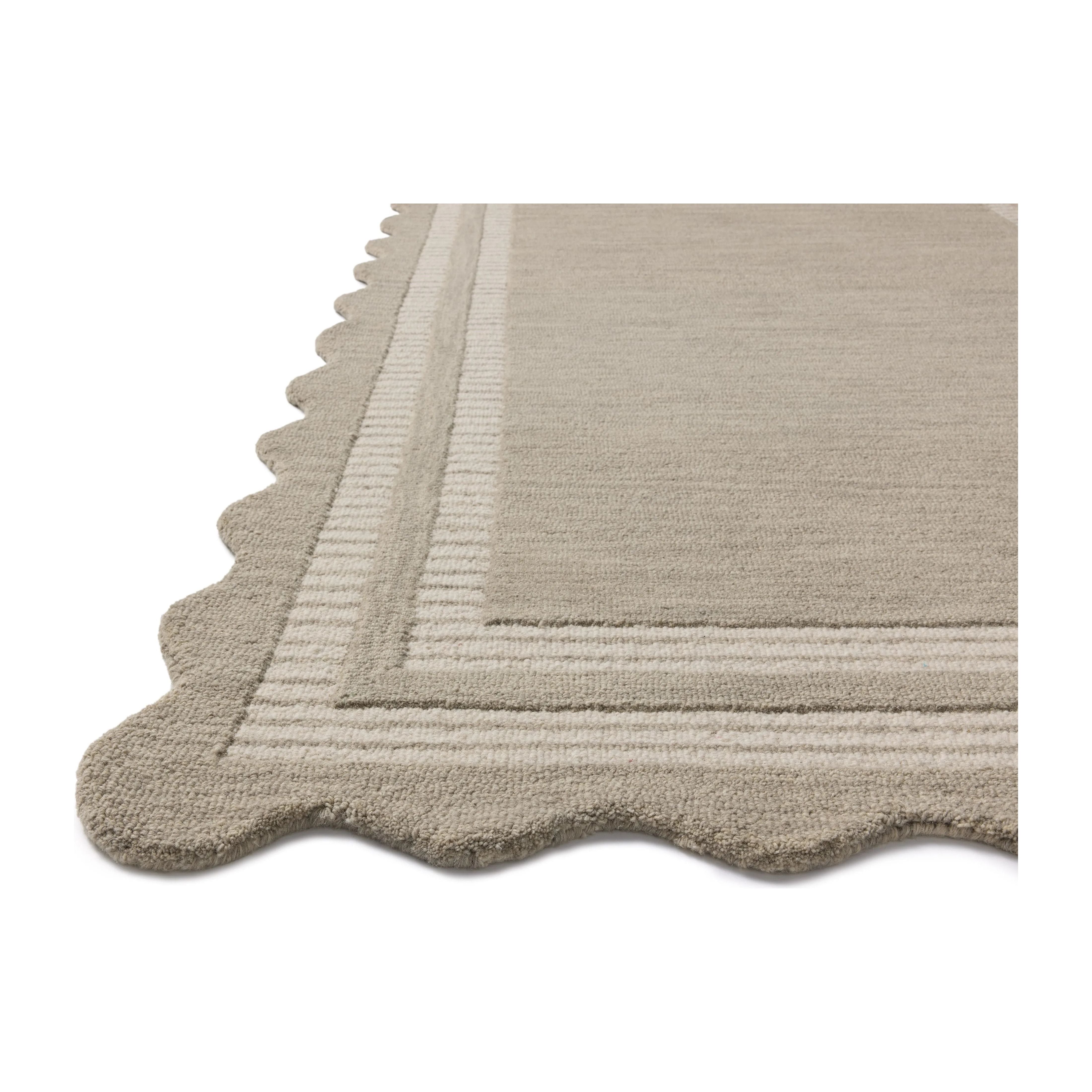 Featuring Chris Loves Julia × Loloi Scottie Fog / Ivory Rug by Loloi at Amethyst Home. The Scottie Collection from Chris Loves Julia x Loloi is a hand-tufted wool area rug with a playful scalloped edge and lower-pile, striped border for a touch of structure. The rugs overall pile is thick and plush, available in easygoing earth tones and neutral colorways. This. Amethyst Home provides interior design, new home construction design consulting, vintage area rugs, and lighting in the Tampa metro area.