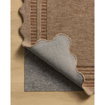 Featuring Chris Loves Julia × Loloi Scottie Mocha / Clay Rug by Loloi at Amethyst Home. The Scottie Collection from Chris Loves Julia x Loloi is a hand-tufted wool area rug with a playful scalloped edge and lower-pile, striped border for a touch of structure. The rugs overall pile is thick and plush, available in easygoing earth tones and neutral colorw. Amethyst Home provides interior design, new home construction design consulting, vintage area rugs, and lighting in the Newport Beach metro area.
