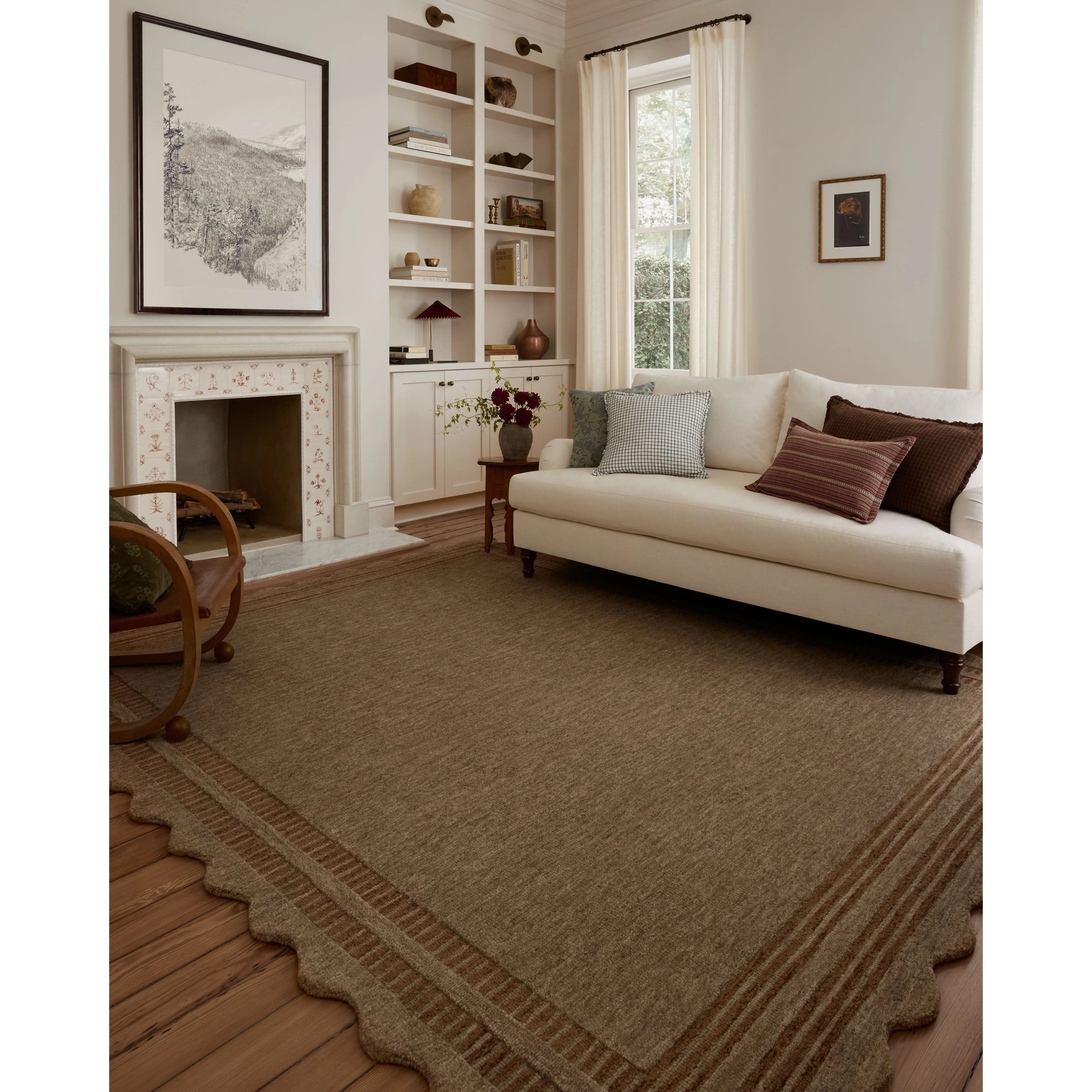 Featuring Chris Loves Julia × Loloi Scottie Mocha / Clay Rug by Loloi at Amethyst Home. The Scottie Collection from Chris Loves Julia x Loloi is a hand-tufted wool area rug with a playful scalloped edge and lower-pile, striped border for a touch of structure. The rugs overall pile is thick and plush, available in easygoing earth tones and neutral colorways.. Amethyst Home provides interior design, new home construction design consulting, vintage area rugs, and lighting in the San Diego metro area.