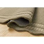 Featuring Chris Loves Julia × Loloi Scottie Olive / Pebble Rug by Loloi at Amethyst Home. The Scottie Collection from Chris Loves Julia x Loloi is a hand-tufted wool area rug with a playful scalloped edge and lower-pile, striped border for a touch of structure. The rugs overall pile is thick and plush, available in easygoing earth tones and neutral colorwa. Amethyst Home provides interior design, new home construction design consulting, vintage area rugs, and lighting in the Alpharetta metro area.