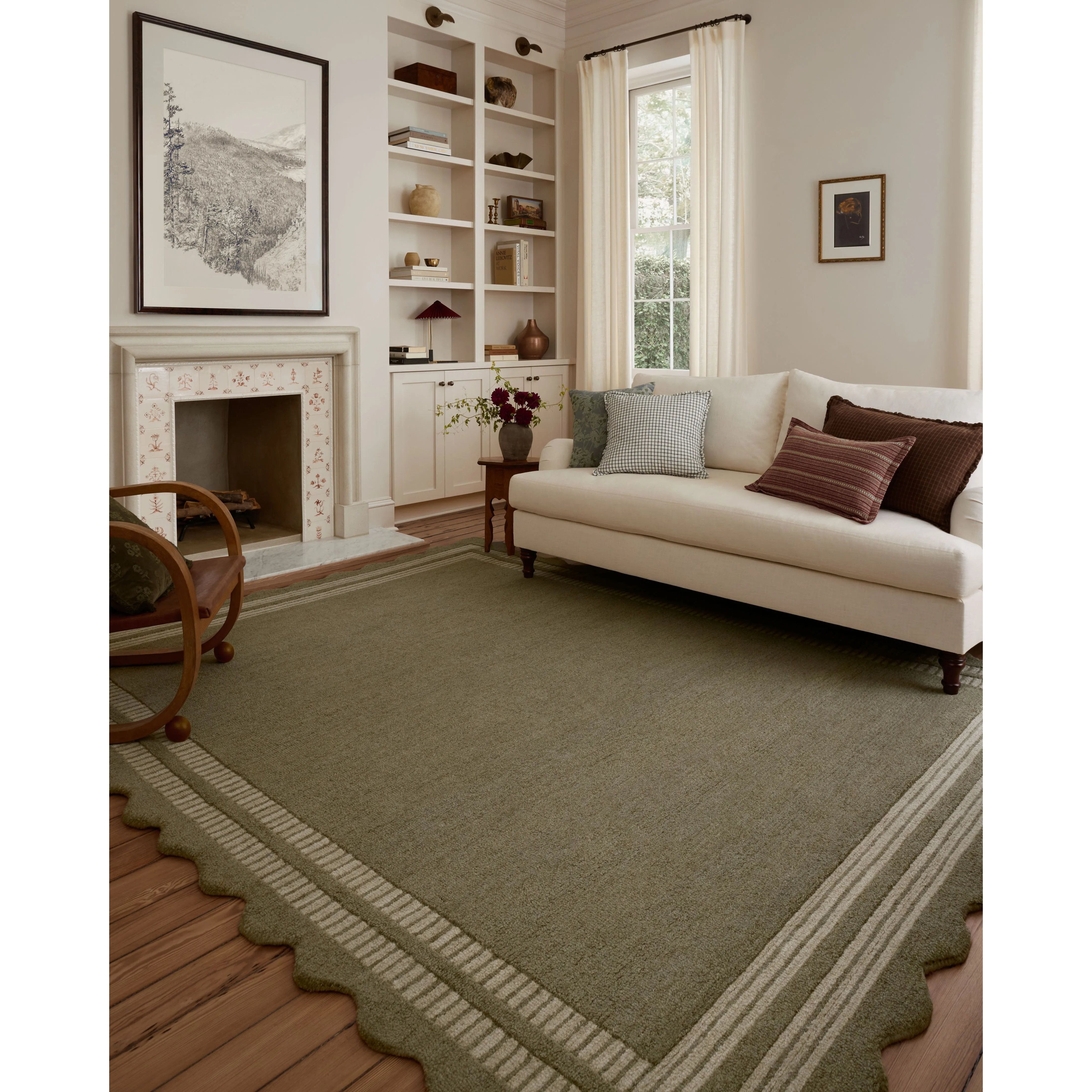 Featuring Chris Loves Julia × Loloi Scottie Olive / Pebble Rug by Loloi at Amethyst Home. The Scottie Collection from Chris Loves Julia x Loloi is a hand-tufted wool area rug with a playful scalloped edge and lower-pile, striped border for a touch of structure. The rugs overall pile is thick and plush, available in easygoing earth tones and neutral colorway. Amethyst Home provides interior design, new home construction design consulting, vintage area rugs, and lighting in the San Diego metro area.