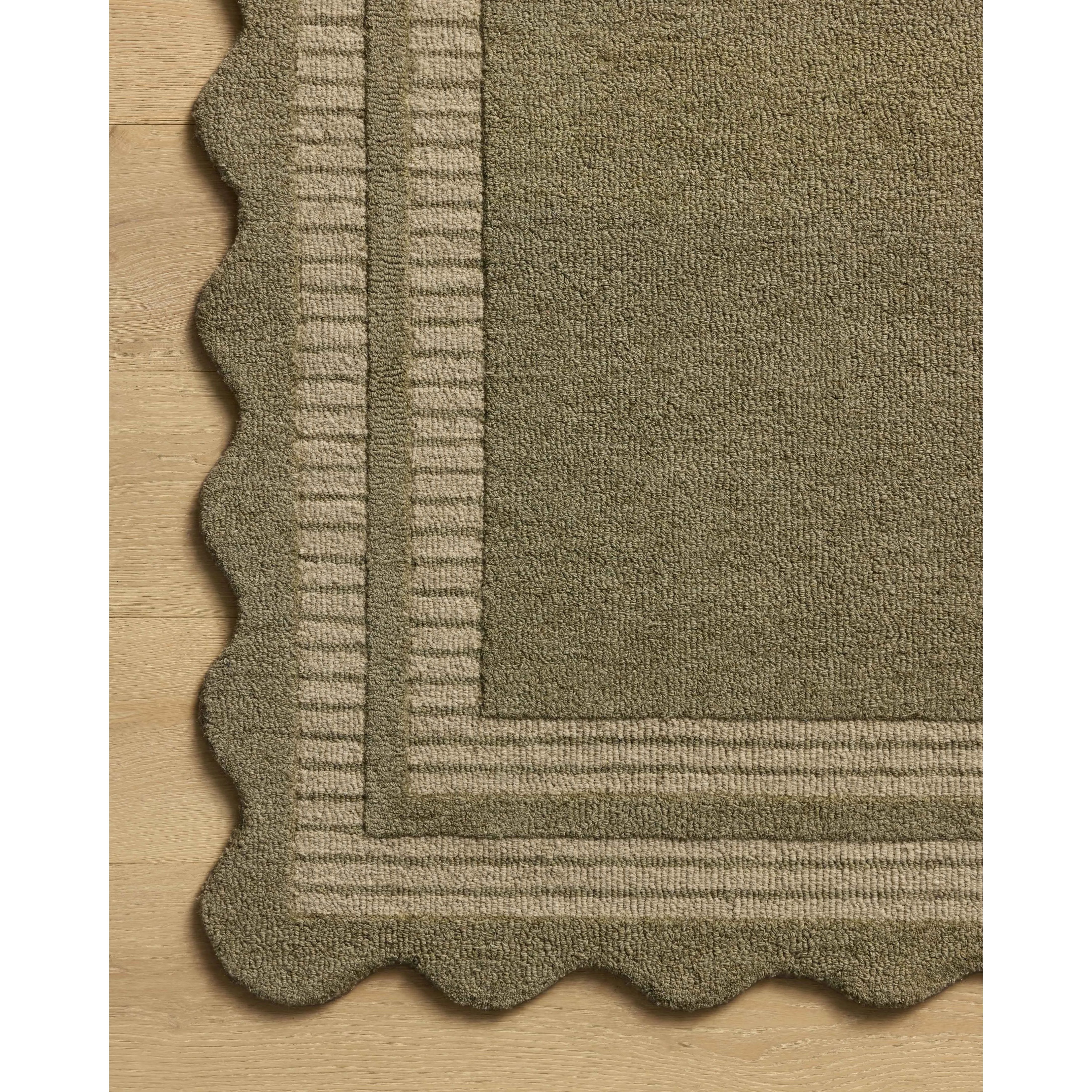 Featuring Chris Loves Julia × Loloi Scottie Olive / Pebble Rug by Loloi at Amethyst Home. The Scottie Collection from Chris Loves Julia x Loloi is a hand-tufted wool area rug with a playful scalloped edge and lower-pile, striped border for a touch of structure. The rugs overall pile is thick and plush, available in easygoing earth tones and neutral colorways.. Amethyst Home provides interior design, new home construction design consulting, vintage area rugs, and lighting in the Seattle metro area.