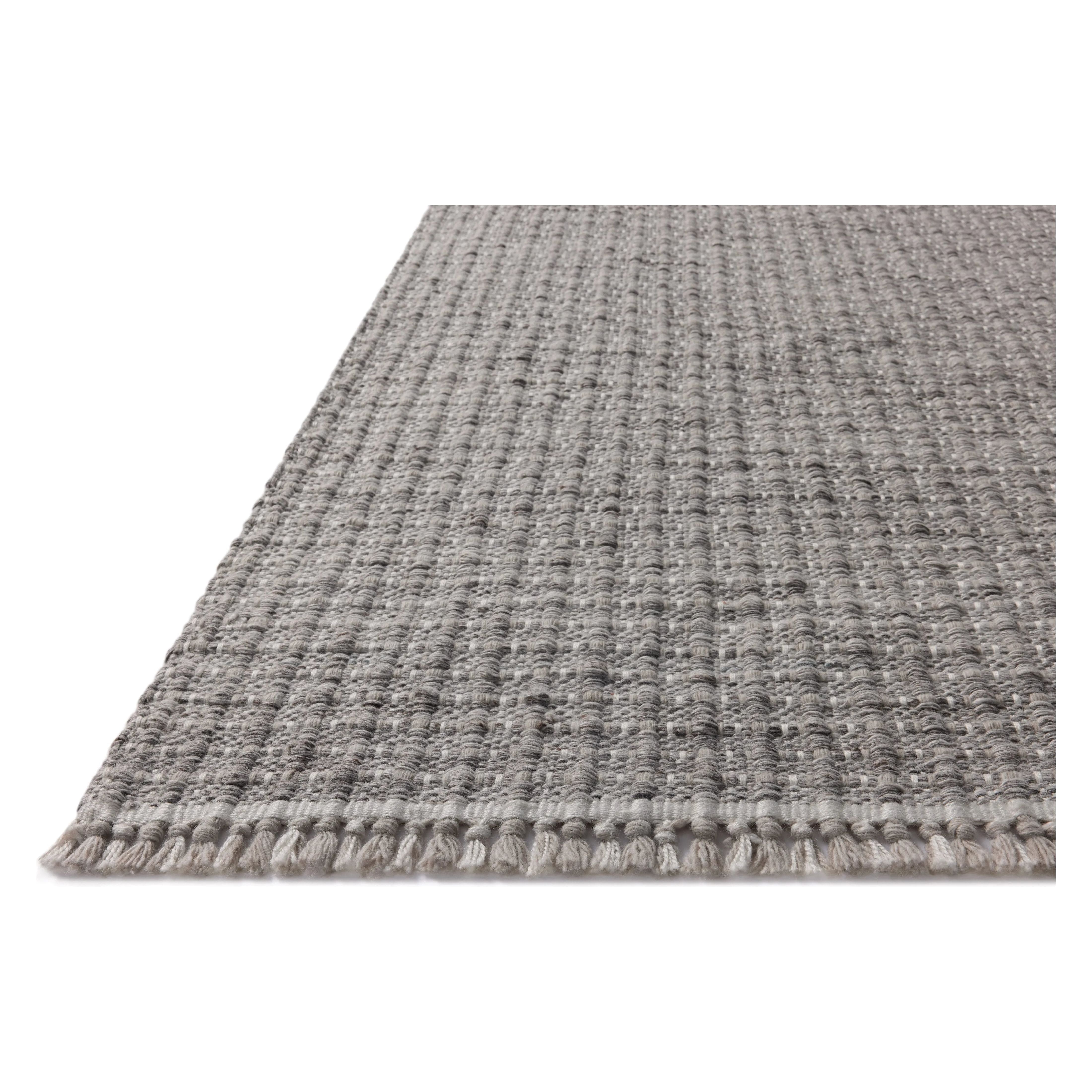 Featuring Duncan Smoke Rug by Loloi at Amethyst Home. The Duncan Collection is a handmade area rug thats interwoven with white threads for subtle contrast and finished with fringed edges. This collection is soft yet exceptionally durable and easy to clean, making it right at home in busy living rooms, entryways, dining rooms, and outdoor patios. Duncan . Amethyst Home provides interior design, new home construction design consulting, vintage area rugs, and lighting in the Winter Garden metro area.