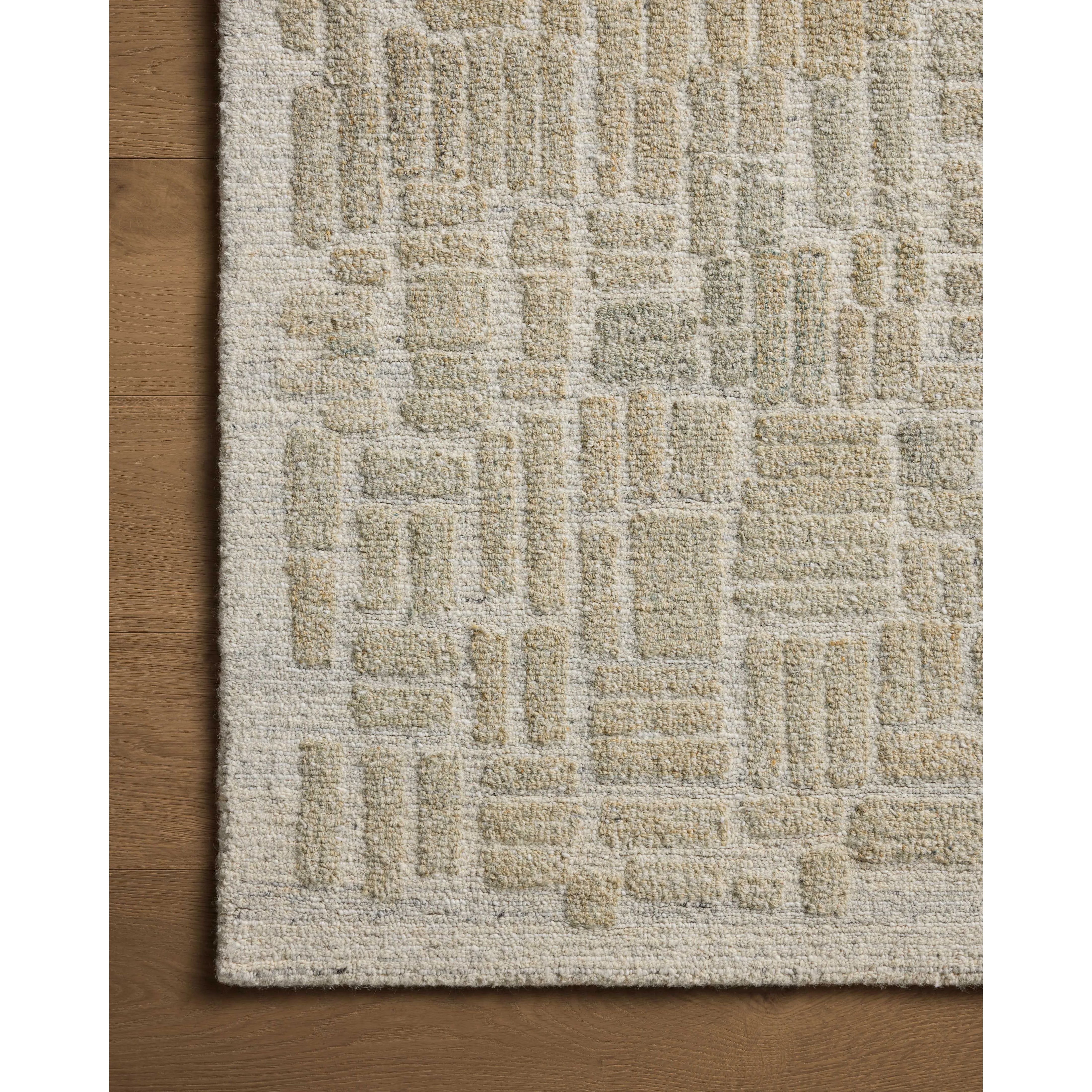 Featuring Elias Pebble / Sage Rug by Loloi at Amethyst Home. The Elias Pebble / Sage Rug is a hand-tufted wool area rug with lively graphic patterns in earth and stone tones. There’s a unique texture to the rug made by over-tufting, in which a design is hand-tufted over a tufted base, creating a subtle high-low pile. This collection is made in India and Goo. Amethyst Home provides interior design, new home construction design consulting, vintage area rugs, and lighting in the Nashville metro area.