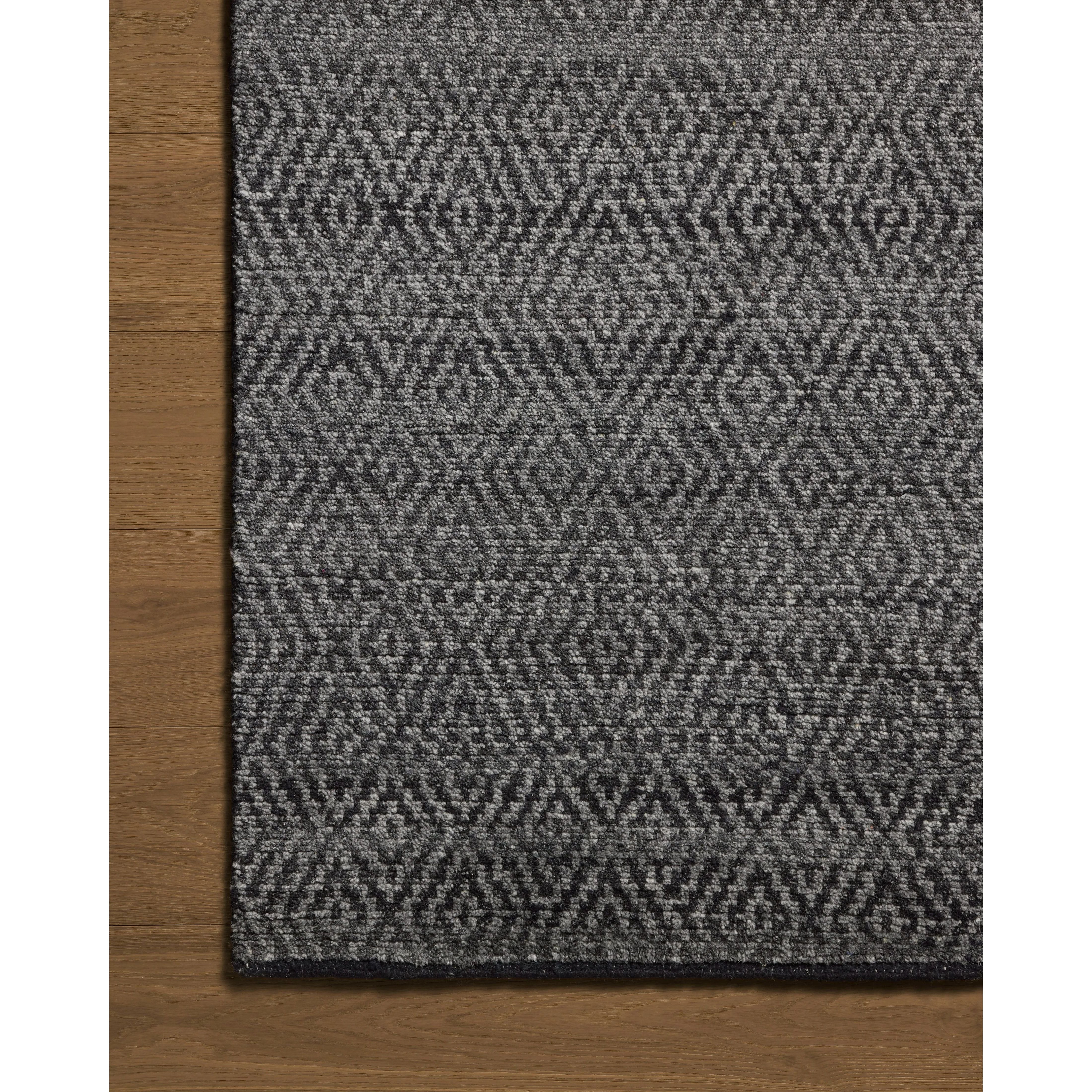 Featuring Jean Stoffer x Loloi Grace Charcoal Hand-Knotted Rug by Loloi at Amethyst Home. The Grace Charcoal Rug is a hand-knotted area rug with patterns inspired by traditional suiting fabrics, like houndstooth and tweed. The design’s smaller-scale patterns create depth, while the classic patterns invoke the warmth of English countryside interiors. This c. Amethyst Home provides interior design, new home construction design consulting, vintage area rugs, and lighting in the Alpharetta metro area.
