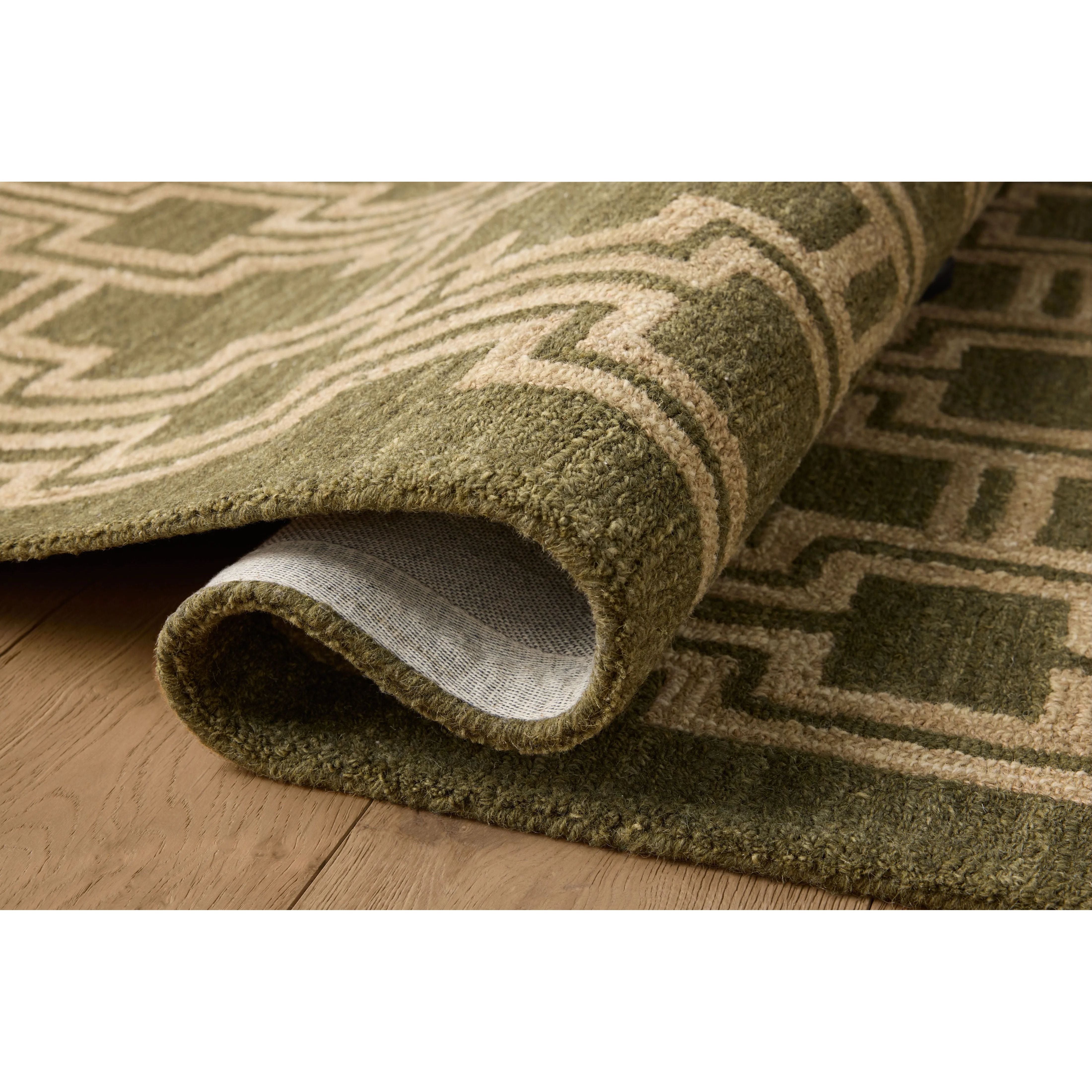 Featuring Jeremiah Brent x Loloi Barrow Moss / Beige Rug by Loloi at Amethyst Home. The Barrow Collection by Jeremiah Brent x Loloi is a hand-tufted area rug with a bold linear design inspired by modern art and classical architecture. The rugs pile is a blend of wool and jute for a stable, substantial feel that can ground living rooms, dining rooms, bedroom. Amethyst Home provides interior design, new home construction design consulting, vintage area rugs, and lighting in the San Diego metro area.