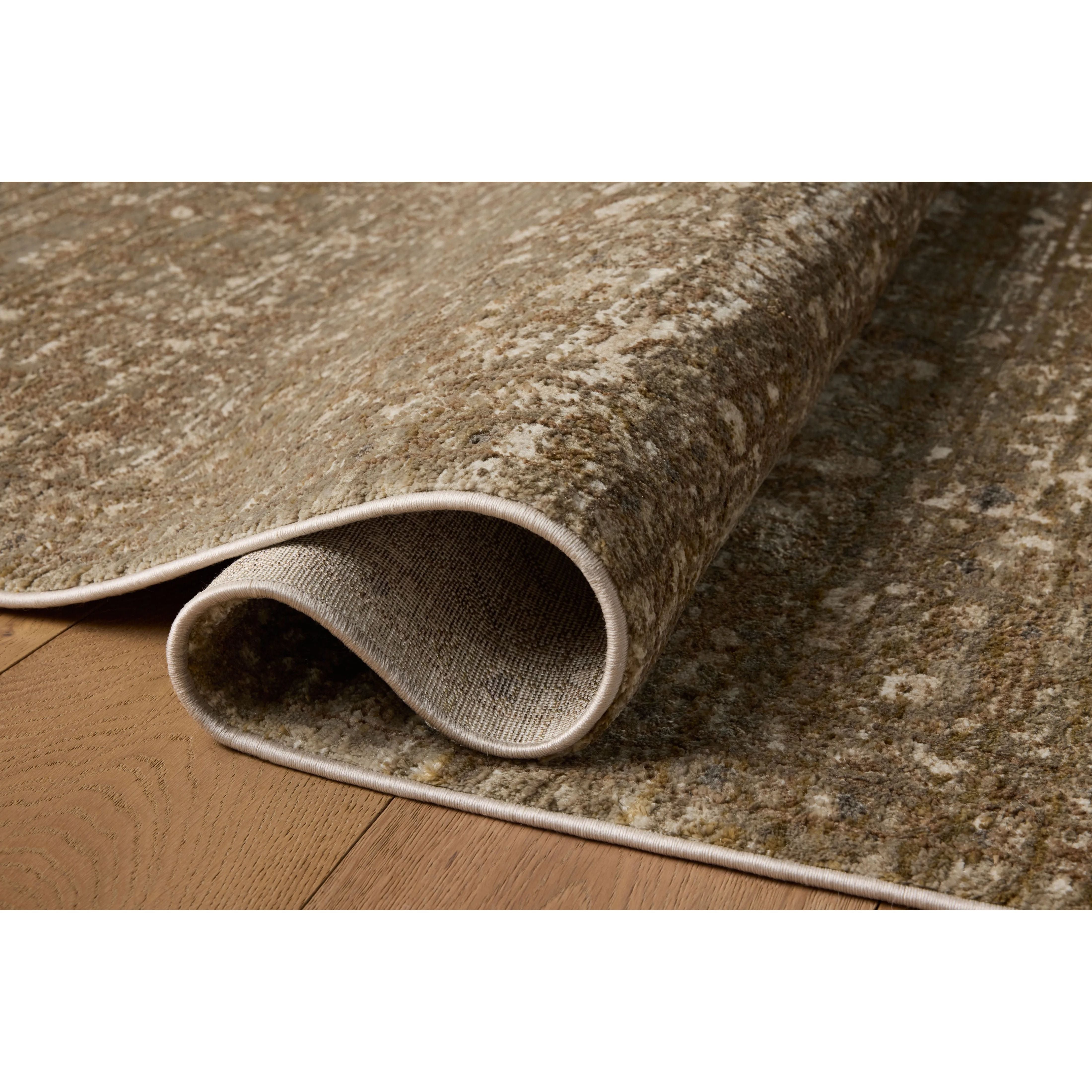 Featuring Haywood Brown Rug by Loloi at Amethyst Home. The Haywood Collection is an easy-to-clean, earth-toned area rug with a subtly distressed traditional design. Haywood is power-loomed of polyester in Turkey, a durable area rug for a living room, bedroom, dining room, or other high-traffic spaces.  Power Loomed  HYD-01 Loloi Ii x Loloi Brown. Amethyst Home provides interior design, new home construction design consulting, vintage area rugs, and lighting in the Des Moines metro area.