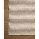 Featuring Sterling Ivory Rug by Loloi at Amethyst Home. Sophisticated ribbing runs across the Sterling Collection, a nicely textured area rug with a natural color palette rich in tonality. Sterling is hand-loomed of polyester that's refreshingly easy to clean and withstands high-traffic in living rooms, dining rooms, or bedrooms. This collection is made in . Amethyst Home provides interior design, new home construction design consulting, vintage area rugs, and lighting in the Nashville metro area.