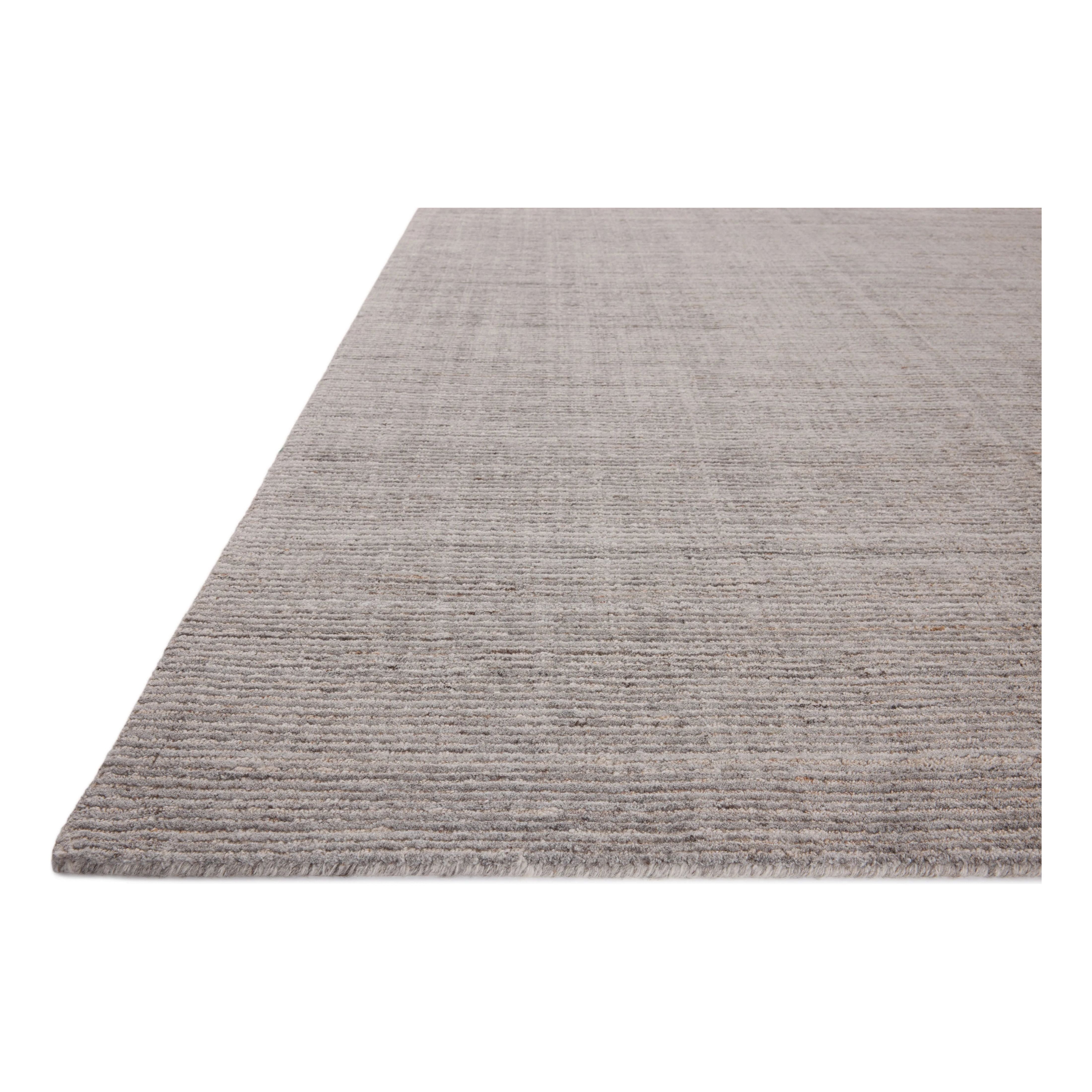 Featuring Thorne Grey Rug by Loloi at Amethyst Home. The Thorne Collection is a hand-loomed area rug with thin, textured lines. The rug's neutral, heathered tones add levity to living rooms, coziness to bedrooms, and casual warmth to dining rooms. Thorne is loomed of durable, easy-to-clean polyester in India and GoodWeave-certified, ensuring our commitment. Amethyst Home provides interior design, new home construction design consulting, vintage area rugs, and lighting in the Washington metro area.