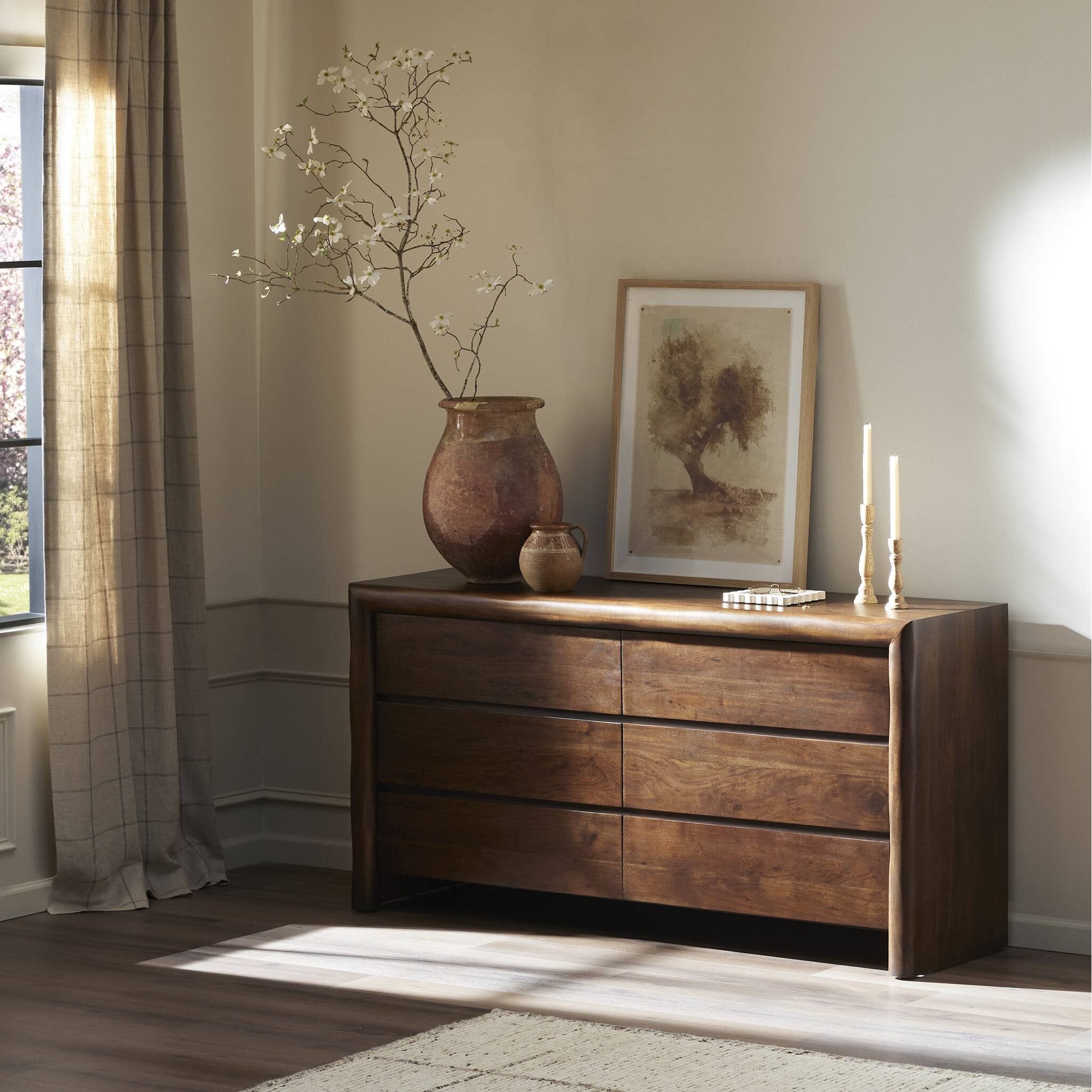Featuring Nigel Rustic Brown Acacia 6 Drawer Dresser by Four Hands at Amethyst Home. Made from solid acacia and finished in a rustic brown, a six-drawer, waterfall-shaped dresser features soft volume, mitered corners and a faux live edge.Overall Dimensions: 69.50"w x 20.00"d x 35.25"hWeight : 278.22 lbsMaterials : Solid Acacia. Amethyst Home provides interior design, new construction, custom furniture, and area rugs in the Kansas City metro area
