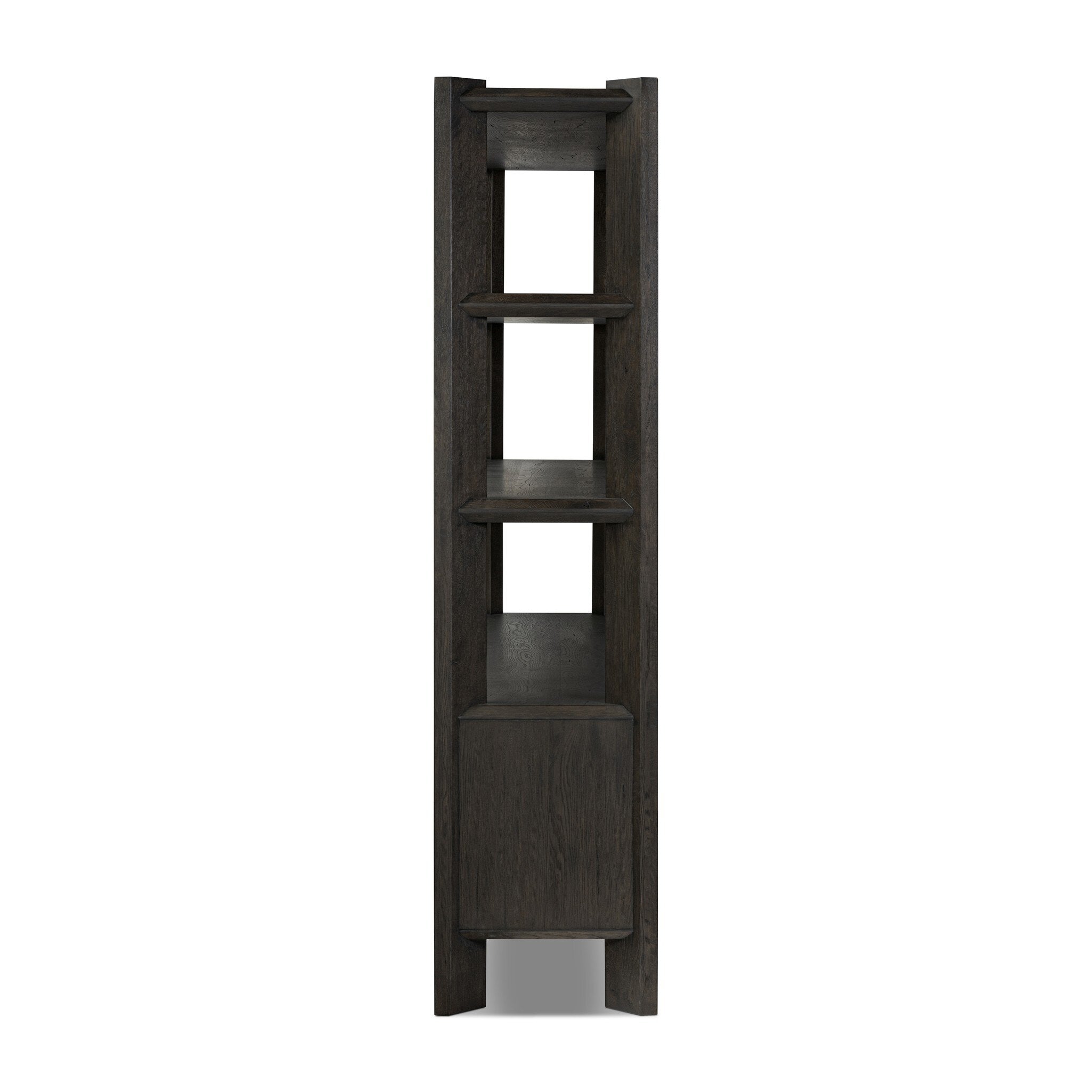 Featuring Orwin Smoked Black Oak Wide Bookshelf by Four Hands at Amethyst Home. A stunner from every angle. Crafted from a mix of solid oak and thick oak veneer, this overscale bookcase features chamfered edges along the shelves and angled outer legs for lots of movement. Finished in a smoked black oak.Overall Dimensions: 84.00"w x 18.00"d x 77.00"hWeight : 326.28 lbsMaterial. Amethyst Home provides interior design, new construction, custom furniture, and area rugs in the Salt Lake City metro area