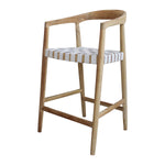 Our Eijnar Counter Stool is crafted from plantation teak wood. The wood has been left unfinished, allowing its raw and unaltered texture to take center stage. The seat of the stool is adorned with a luxurious touch – cow top leather. The leather is white in color, adding a clean and timeless aesthetic to the piece. Amethyst Home provides interior design, new construction, custom furniture, and area rugs in the Scottsdale metro area