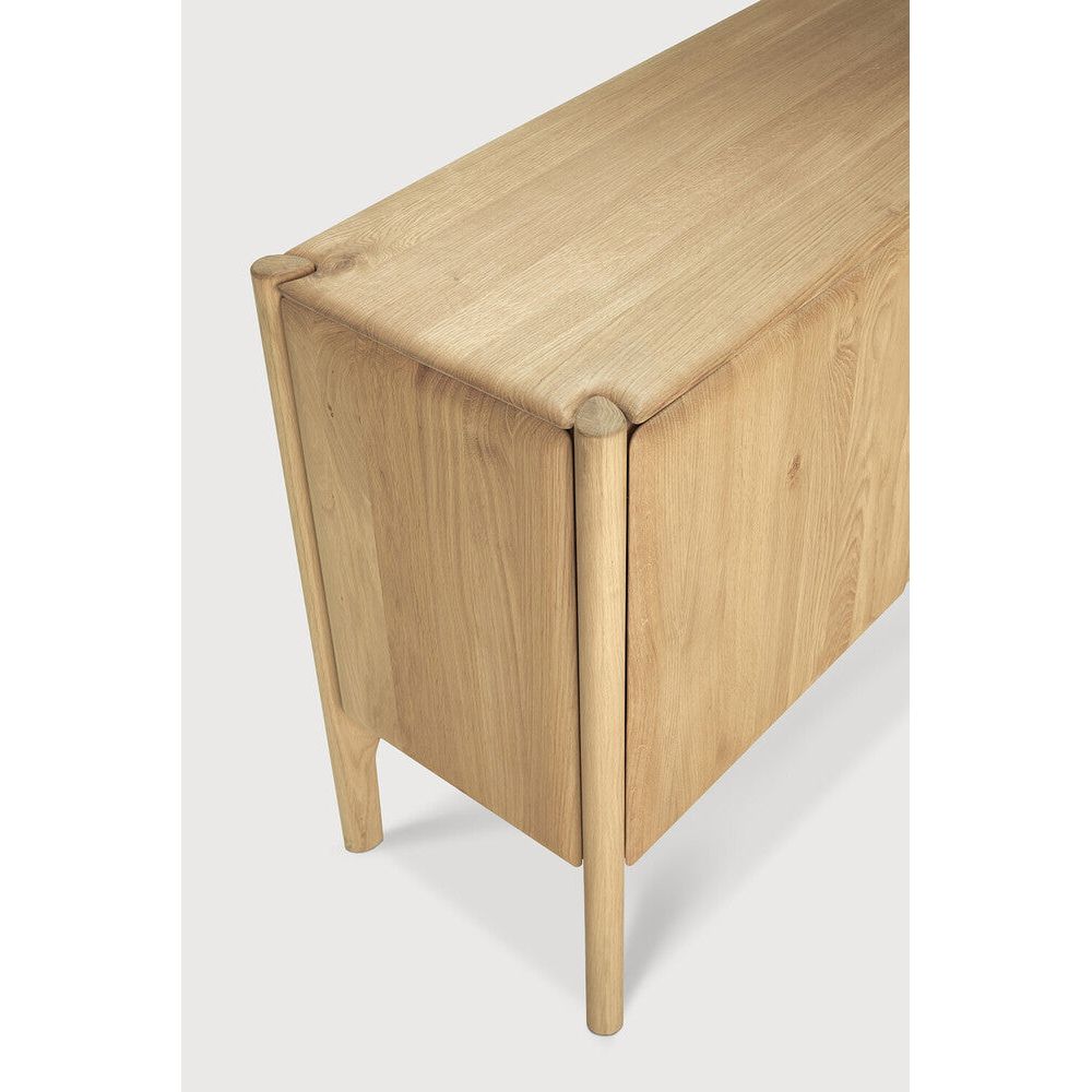 Featuring Pi Oak Sideboard by Ethnicraft at Amethyst Home. The PI collection honours nature’s design by keeping the strength, curves and lines, as nature intended. Interesting shapes are discovered in this sleek and stylish, polished imperfect, finish. Each PI item is finished by hand to ensure that the individual character of the wood is respected. The PI sideboard is striking and u. Amethyst Home provides interior design, new construction, custom furniture, and area rugs in the Boston metro area