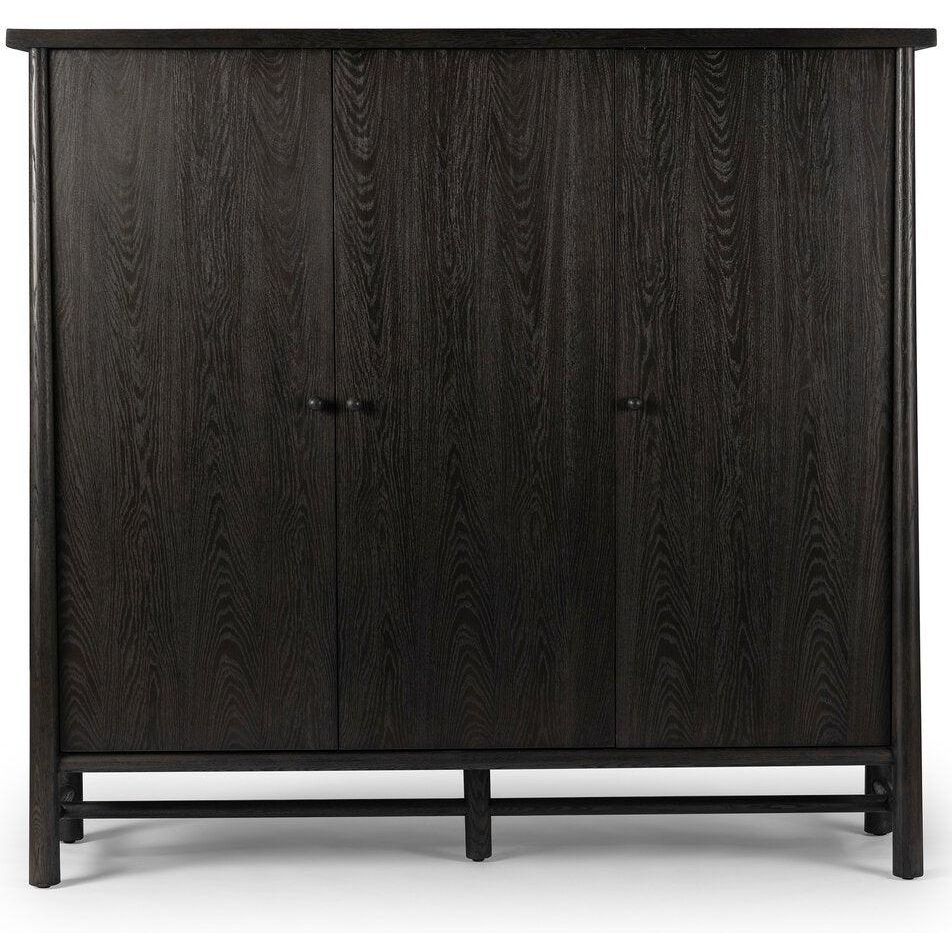 Featuring Renaud Charcoal Oak Veneer 3-Door Cabinet by Four Hands at Amethyst Home. Expertly crafted from oak veneer, the Renaud 3-door cabinet offers a sleek and stylish storage solution. Its solid construction provides durability, while its charcoal finish adds a touch of sophistication. With three spacious compartments, this cabinet ensures ample space to organize and declu. Amethyst Home provides interior design, new construction, custom furniture, and area rugs in the Winter Garden metro area