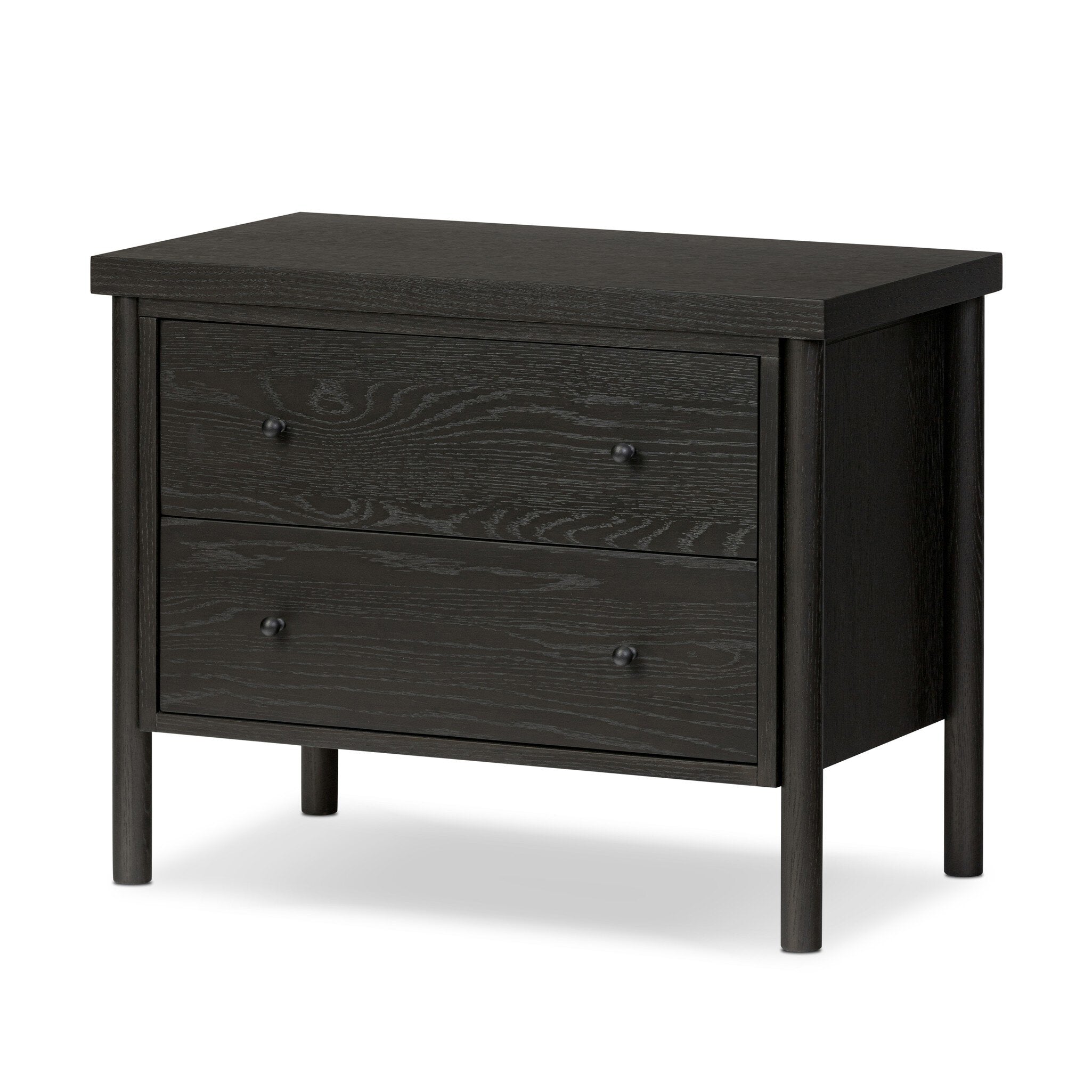 Featuring Roark Ebony Oak Veneer Nightstand by Four Hands at Amethyst Home. Rounded, chunky dowel legs in a black oak finish support the overhang top of this nightstand. Two drawers provide ample storage, finished with simple gunmetal hardware.Overall Dimensions: 30.00"w x 17.00"d x 24.00"hWeight : 76.06 lbsMaterials : Oak Veneer, Solid Oak. Amethyst Home provides interior design, new construction, custom furniture, and area rugs in the Kansas City metro area
