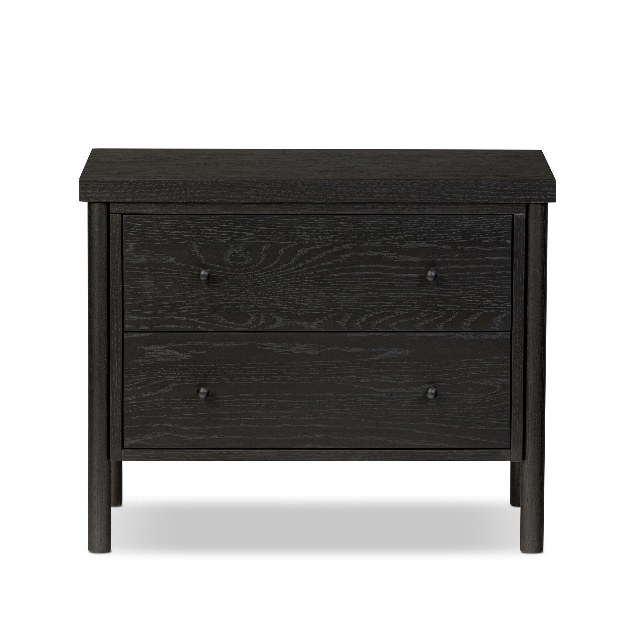 Featuring Roark Ebony Oak Veneer Nightstand by Four Hands at Amethyst Home. Rounded, chunky dowel legs in a black oak finish support the overhang top of this nightstand. Two drawers provide ample storage, finished with simple gunmetal hardware.Overall Dimensions: 30.00"w x 17.00"d x 24.00"hWeight : 76.06 lbsMaterials : Oak Veneer, Solid Oak. Amethyst Home provides interior design, new construction, custom furniture, and area rugs in the Los Angeles metro area