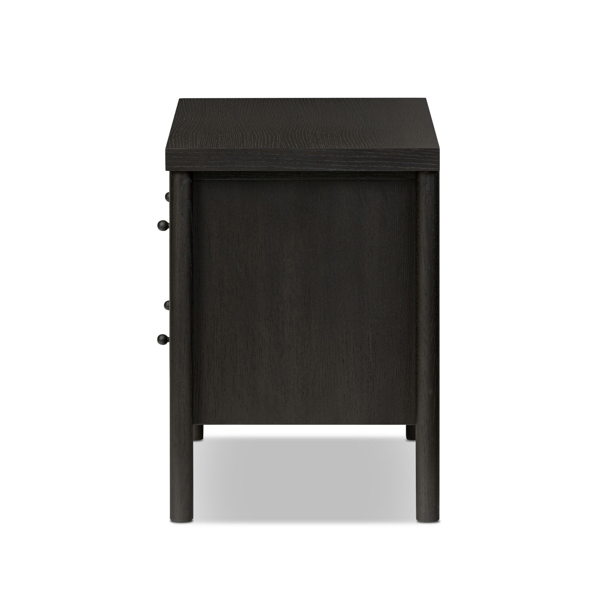 Featuring Roark Ebony Oak Veneer Nightstand by Four Hands at Amethyst Home. Rounded, chunky dowel legs in a black oak finish support the overhang top of this nightstand. Two drawers provide ample storage, finished with simple gunmetal hardware.Overall Dimensions: 30.00"w x 17.00"d x 24.00"hWeight : 76.06 lbsMaterials : Oak Veneer, Solid Oak. Amethyst Home provides interior design, new construction, custom furniture, and area rugs in the Salt Lake City metro area