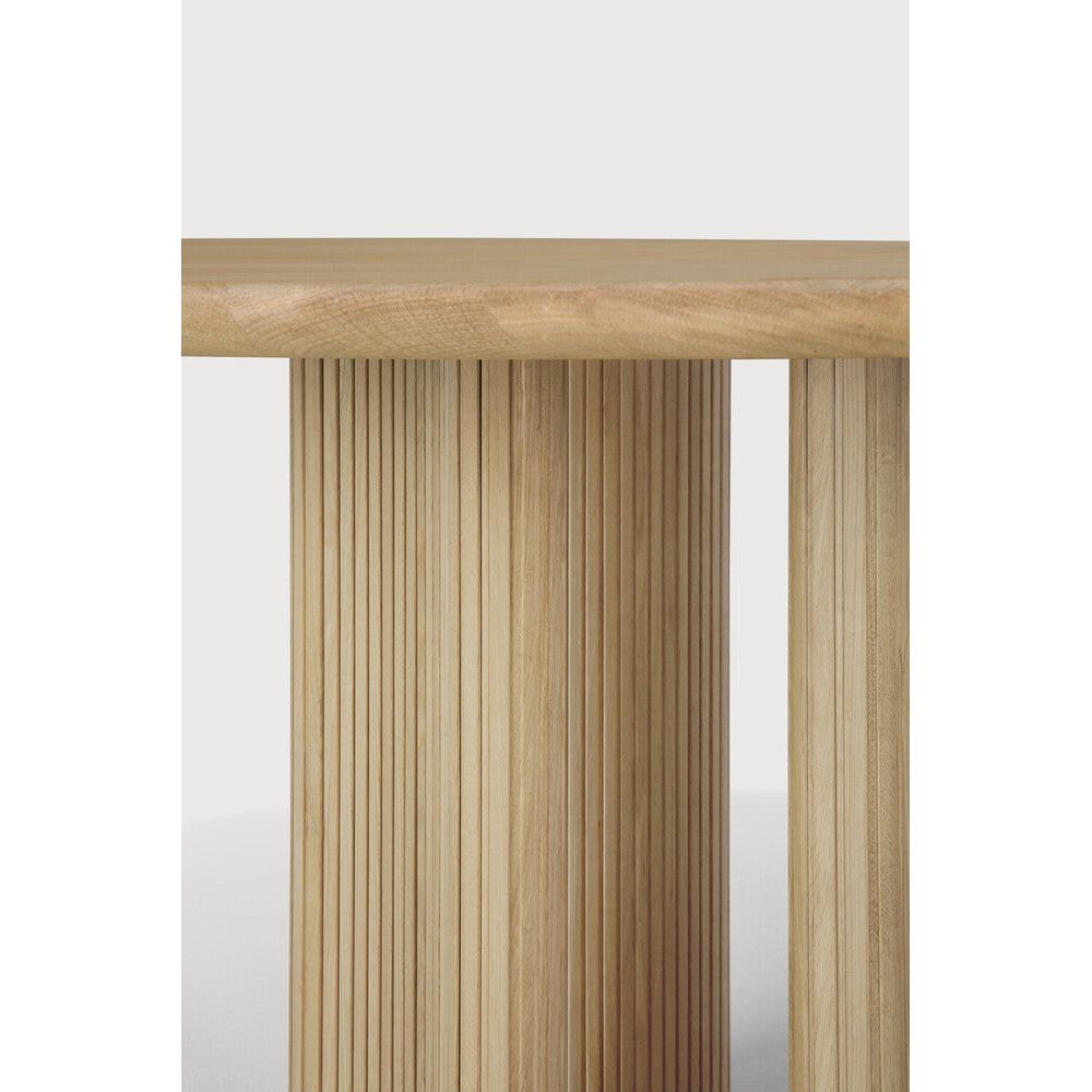 Featuring Roller Oak Round Max Dining Table by Ethnicraft at Amethyst Home. The Roller Max collection is remarkable in its design, distinguished with its stacked wood-stick effect. The dining table perfectly melds form with function. Featuring the option of reversable legs that can change the aesthetic to reflect personal style.Weight : 163 lbs Dimensions: 59.5" W x 59.5" L x 30" H. Amethyst Home provides interior design, new construction, custom furniture, and area rugs in the Portland metro area